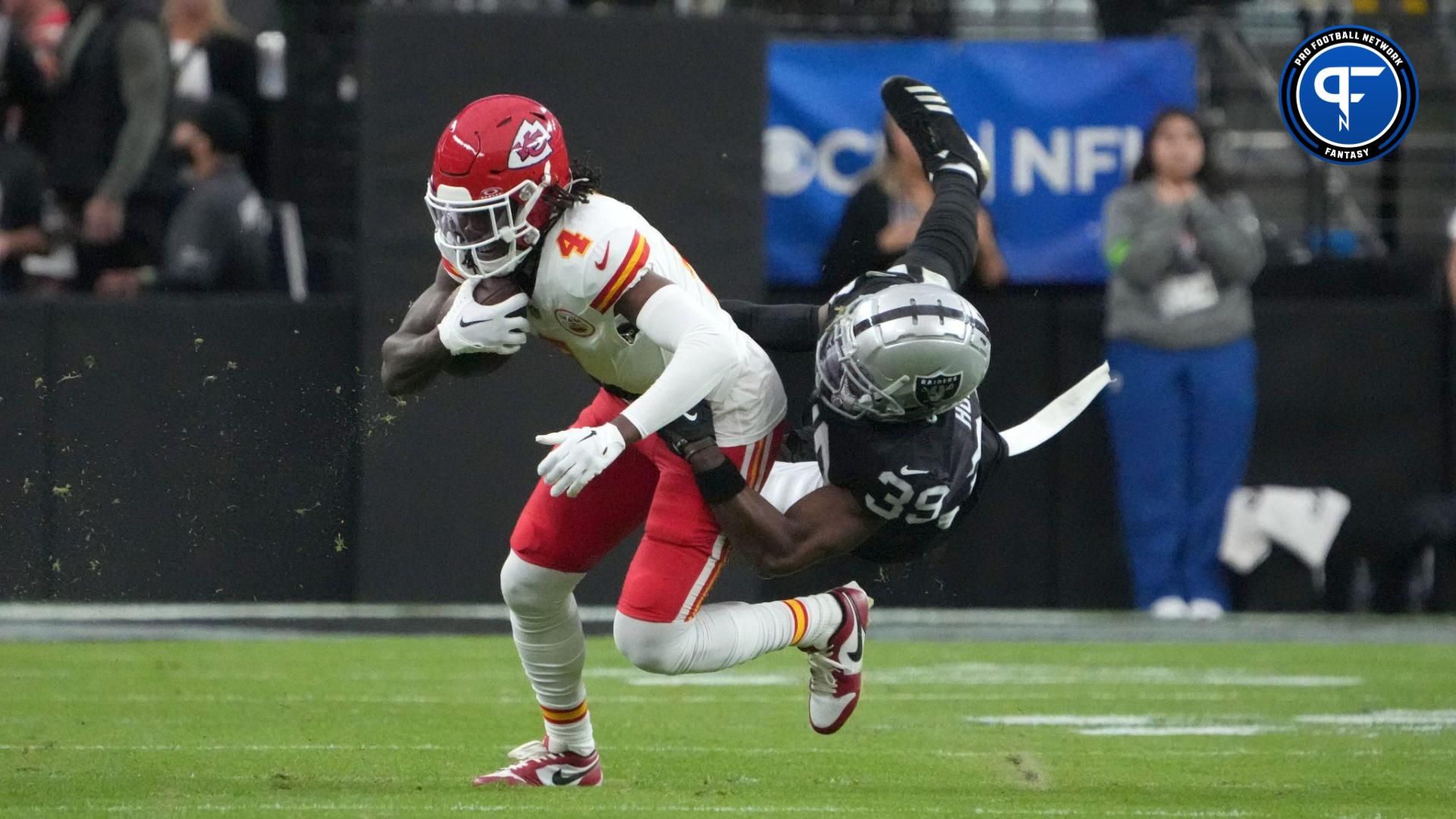 Nov 26, 2023; Paradise, Nevada, USA; Kansas City Chiefs wide receiver Rashee Rice (4) is tackled by Las Vegas Raiders cornerback Nate Hobbs (39) in the first half at Allegiant Stadium. Mandatory Credit: Kirby Lee-USA TODAY Sports