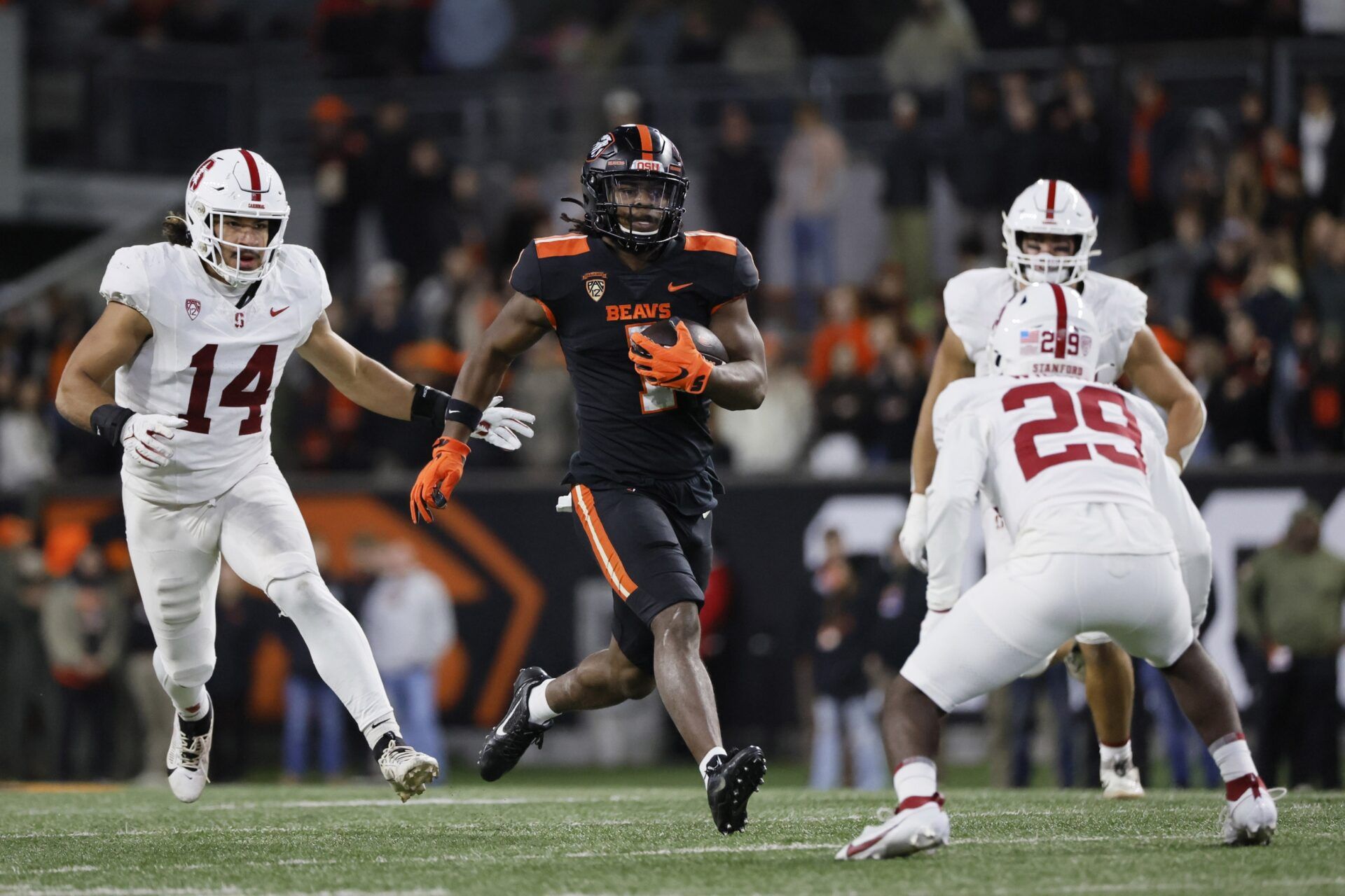 Oregon State Beavers running back Deshaun Fenwick (1) runs the ball against Stanford Cardinal corner back Terian Williams (29) during the second half at Reser Stadium. Mandatory Credit: Soobum Im-USA TODAY Sports