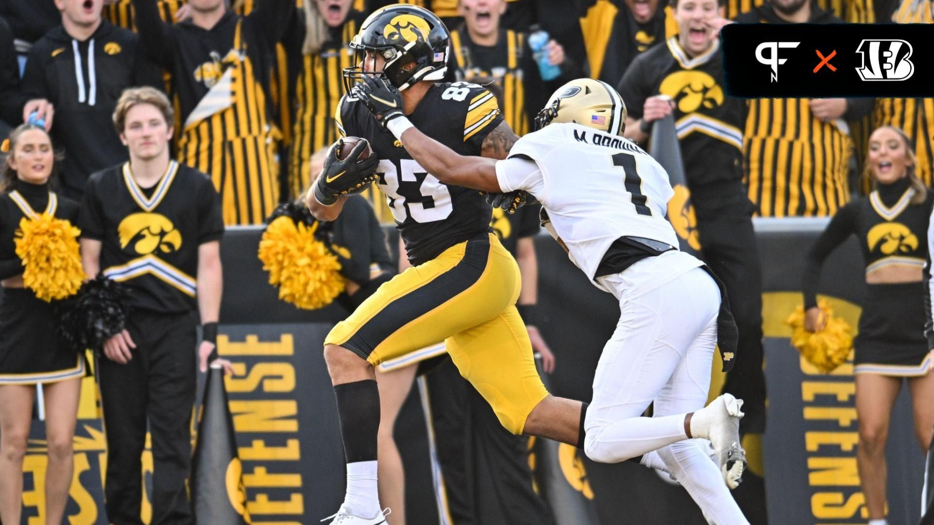 Iowa Hawkeyes tight end Erick All (83) catches a touchdown pass from quarterback Deacon Hill (not pictured) as Purdue Boilermakers Markevious Brown (1) defends during the fourth quarter at Kinnick Stadium.