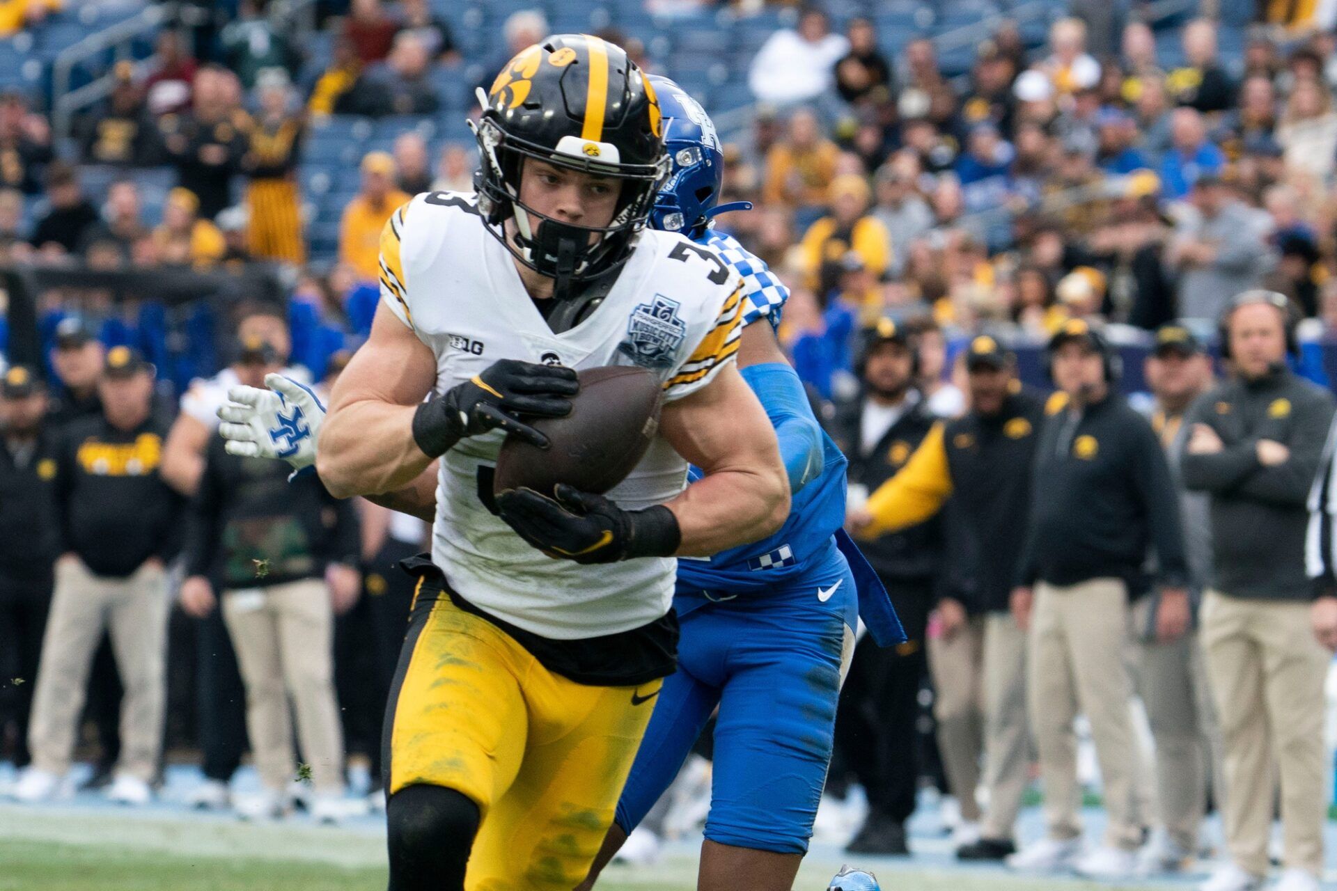 Iowa defensive back Cooper DeJean (3) pulls in an interception for a touchdown over Kentucky wide receiver Barion Brown (2) during the second quarter of the TransPerfect Music City Bowl at Nissan Stadium Saturday, Dec. 31, 2022, in Nashville, Tenn. Ncaa Football Music City Bowl Iowa At Kentucky