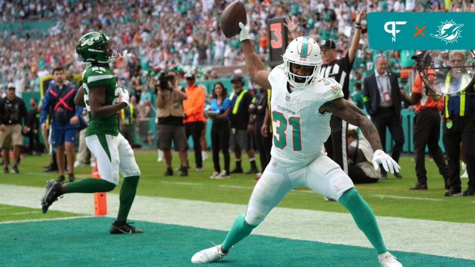 Miami Dolphins RB Raheem Mostert (31) spikes the football in celebration after a touchdown against the New York Jets.