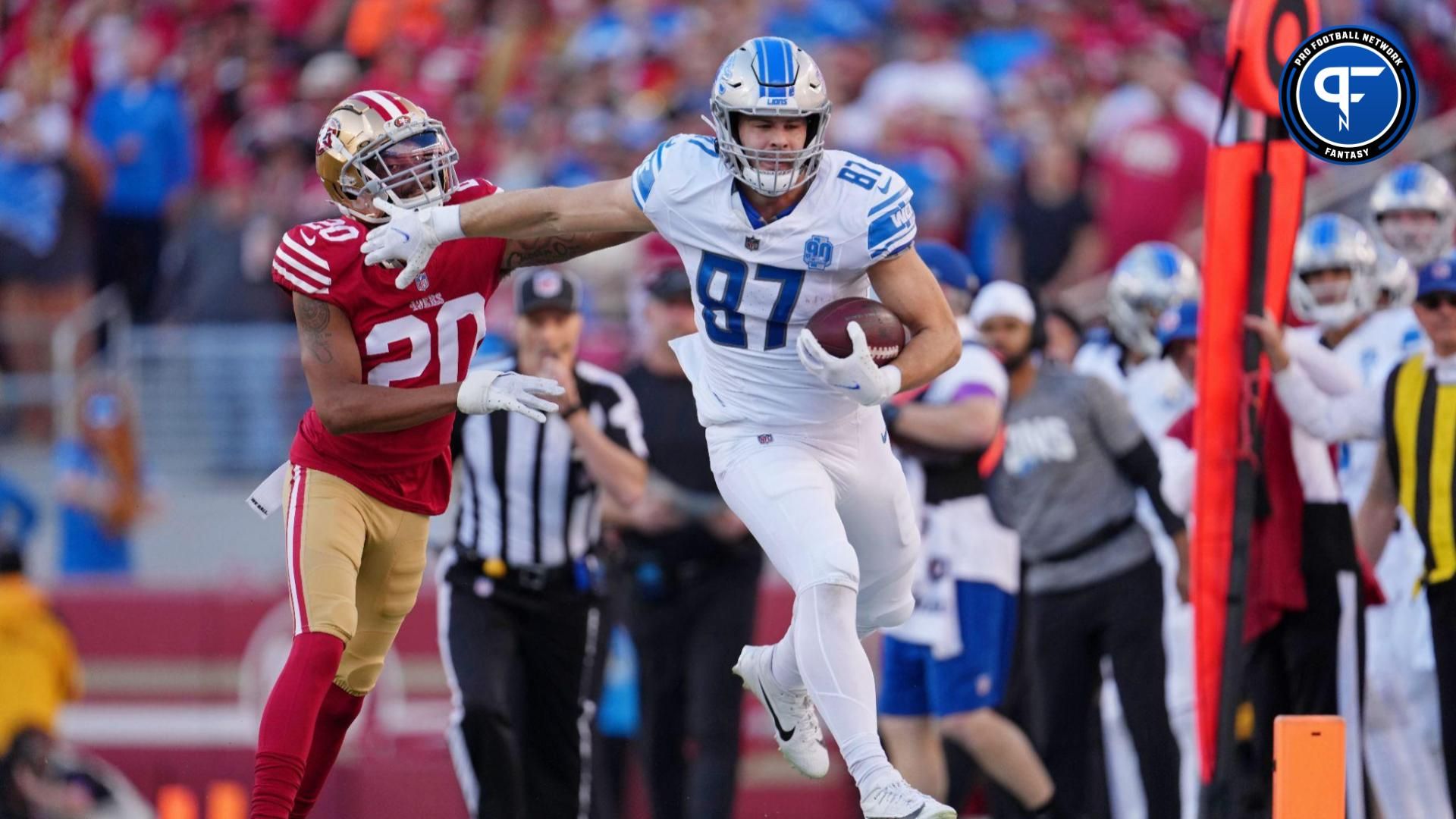 Detroit Lions tight end Sam LaPorta (87) runs with the ball against San Francisco 49ers cornerback Ambry Thomas (20) during the first half of the NFC Championship football game at Levi's Stadium