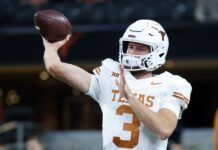 Texas Longhorns quarterback Quinn Ewers (3) warms up before the game against the Oklahoma State Cowboys at AT&T Stadium. Mandatory Credit: Kevin Jairaj-USA TODAY Sports