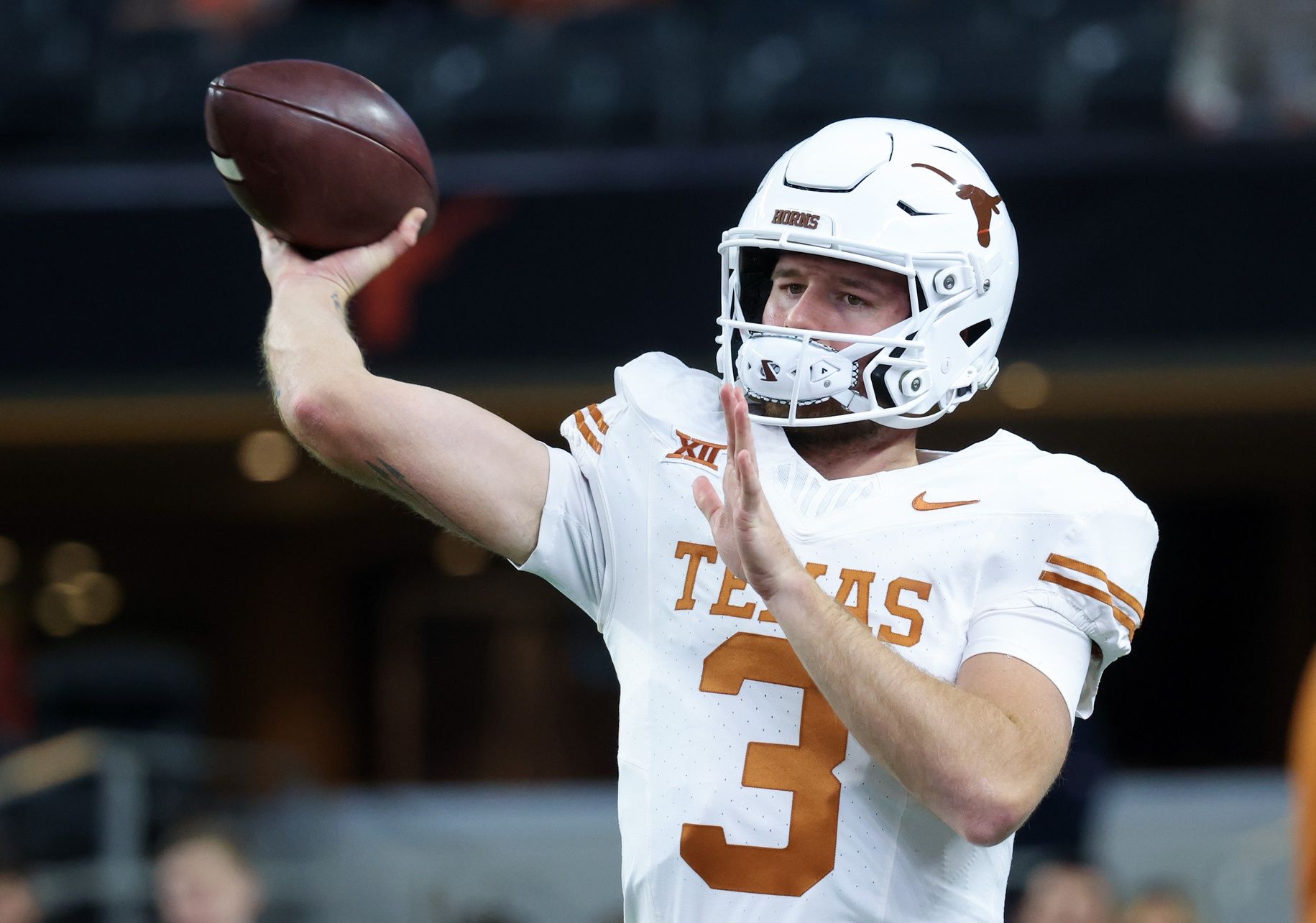 Texas Longhorns quarterback Quinn Ewers (3) warms up before the game against the Oklahoma State Cowboys at AT&T Stadium. Mandatory Credit: Kevin Jairaj-USA TODAY Sports