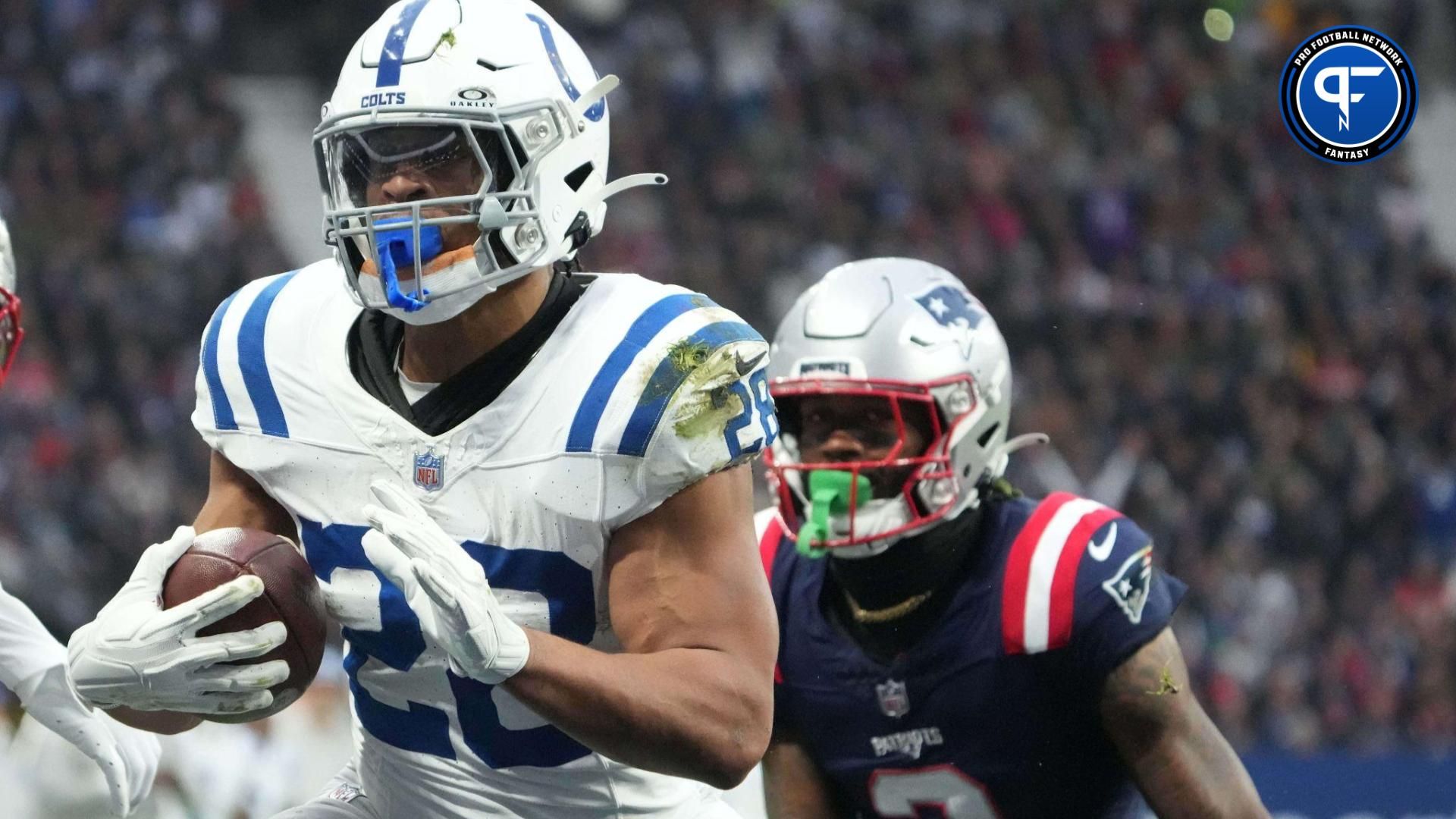 Indianapolis Colts RB Jonathan Taylor (28) rushes the ball against the New England Patriots.