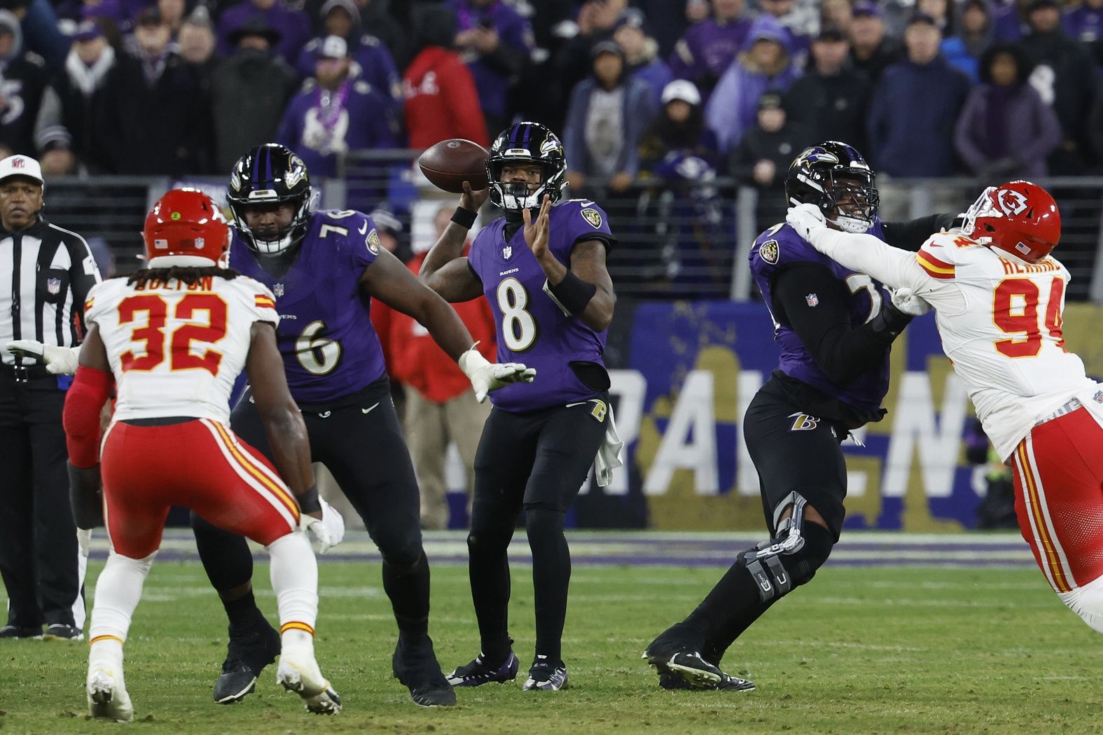 Baltimore Ravens quarterback Lamar Jackson (8) prepares to throw the ball during the second half against the Kansas City Chiefs in the AFC Championship football game at M&T Bank Stadium.