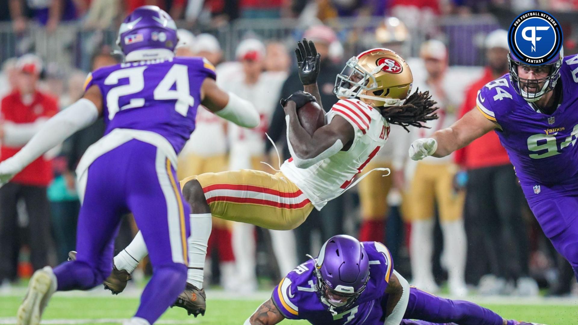 San Francisco 49ers wide receiver Brandon Aiyuk (11) is tackled by Minnesota Vikings cornerback Byron Murphy Jr. (7) in the second quarter at U.S. Bank Stadium.