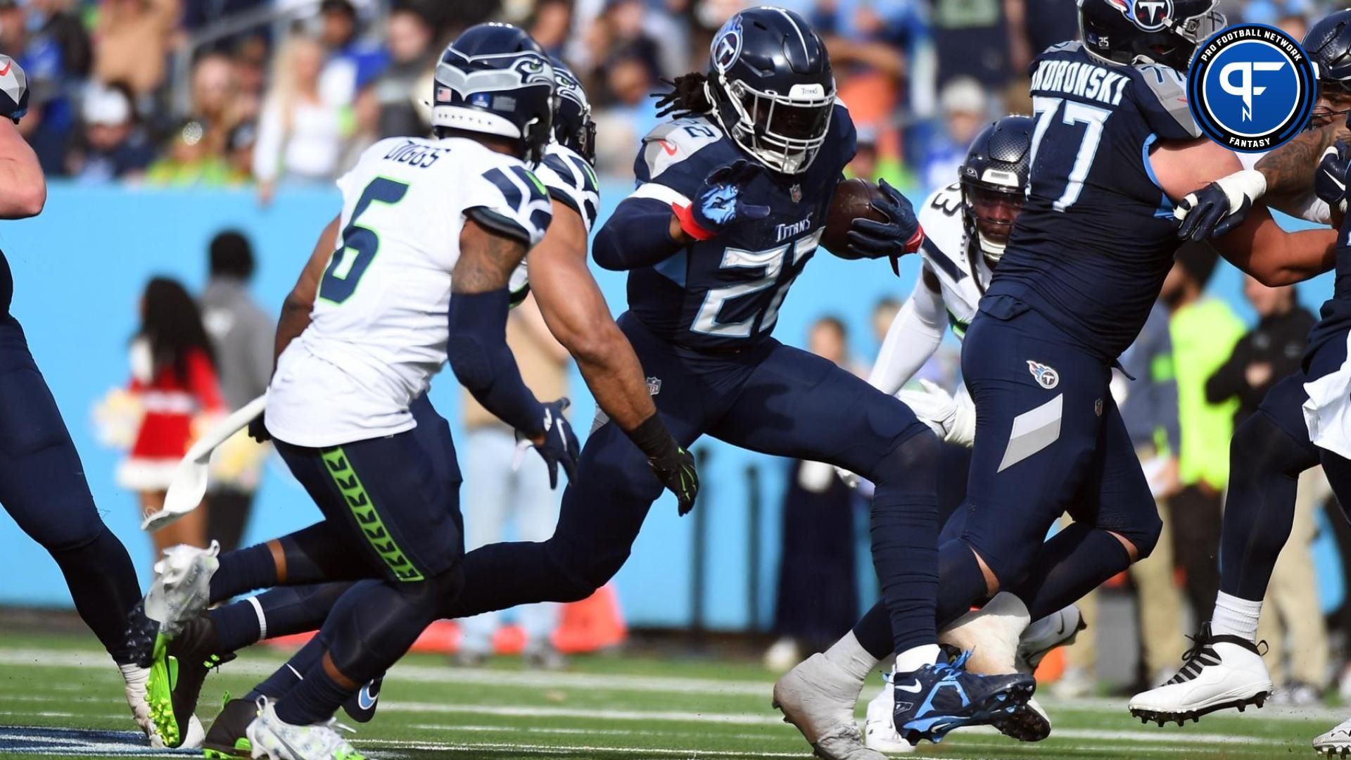 Tennessee Titans running back Derrick Henry (22) runs for a first down during the first half against the Seattle Seahawks at Nissan Stadium.