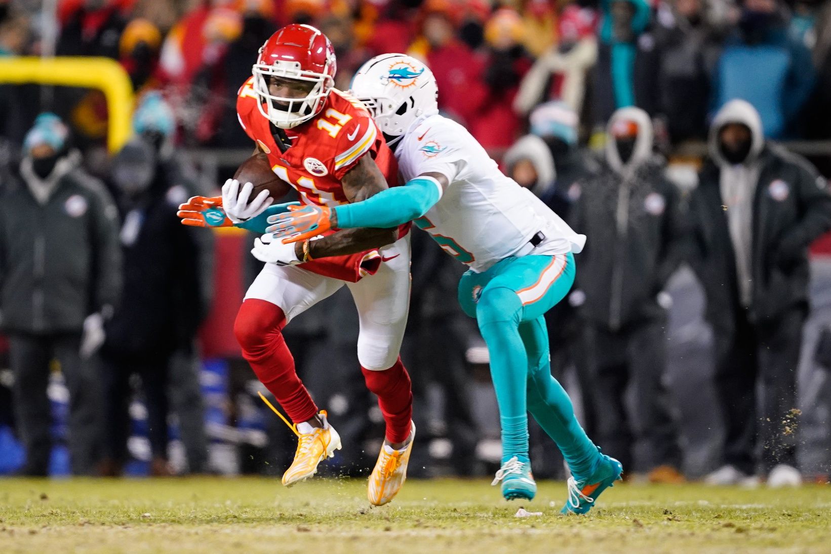 Kansas City Chiefs wide receiver Marquez Valdes-Scantling (11) runs the ball against Miami Dolphins cornerback Jalen Ramsey (5) during the first half of the 2024 AFC wild card game at GEHA Field at Arrowhead Stadium.