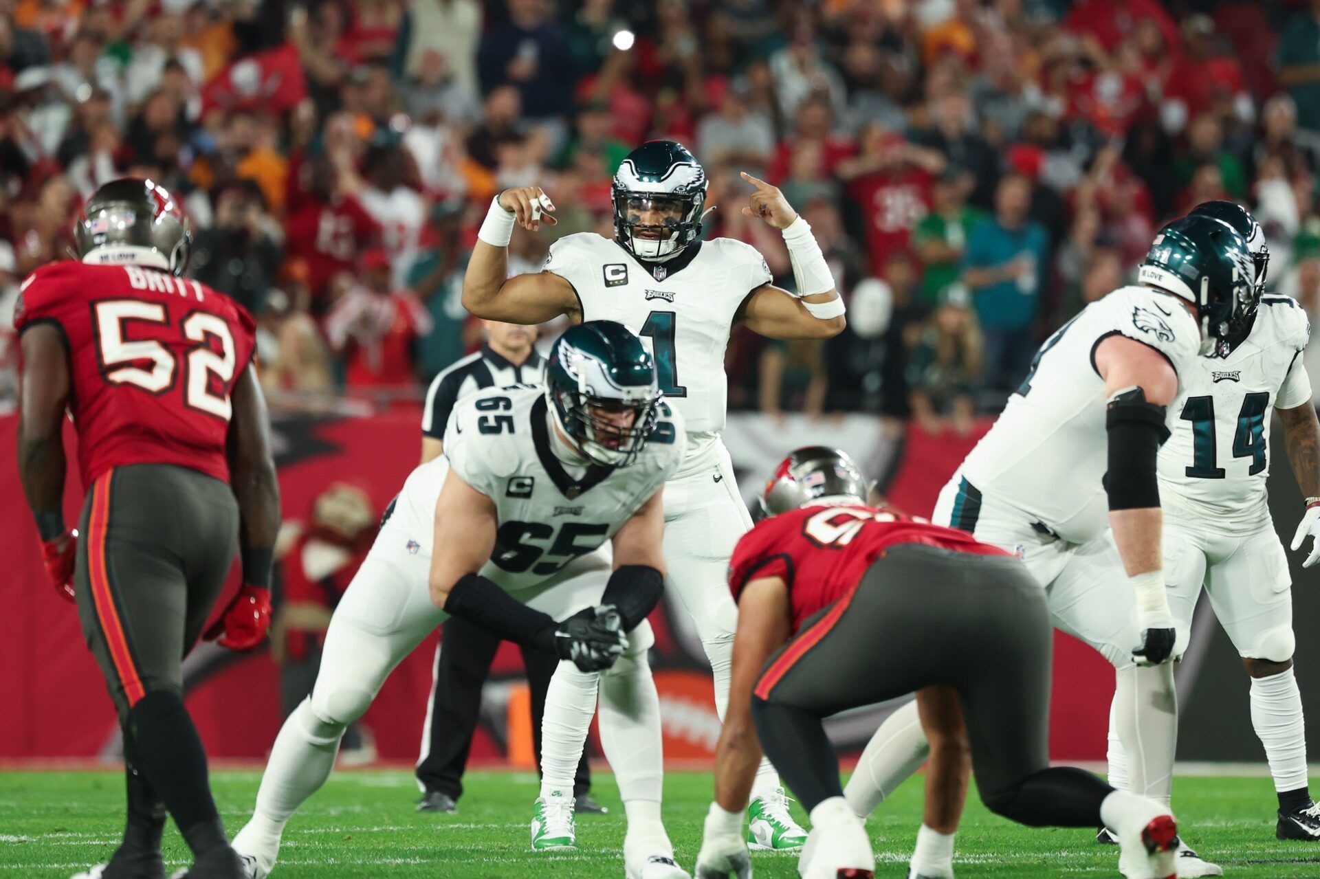 Philadelphia Eagles quarterback Jalen Hurts (1) gestures before the snap against the Tampa Bay Buccaneers during the first half of a 2024 NFC wild card game at Raymond James Stadium.