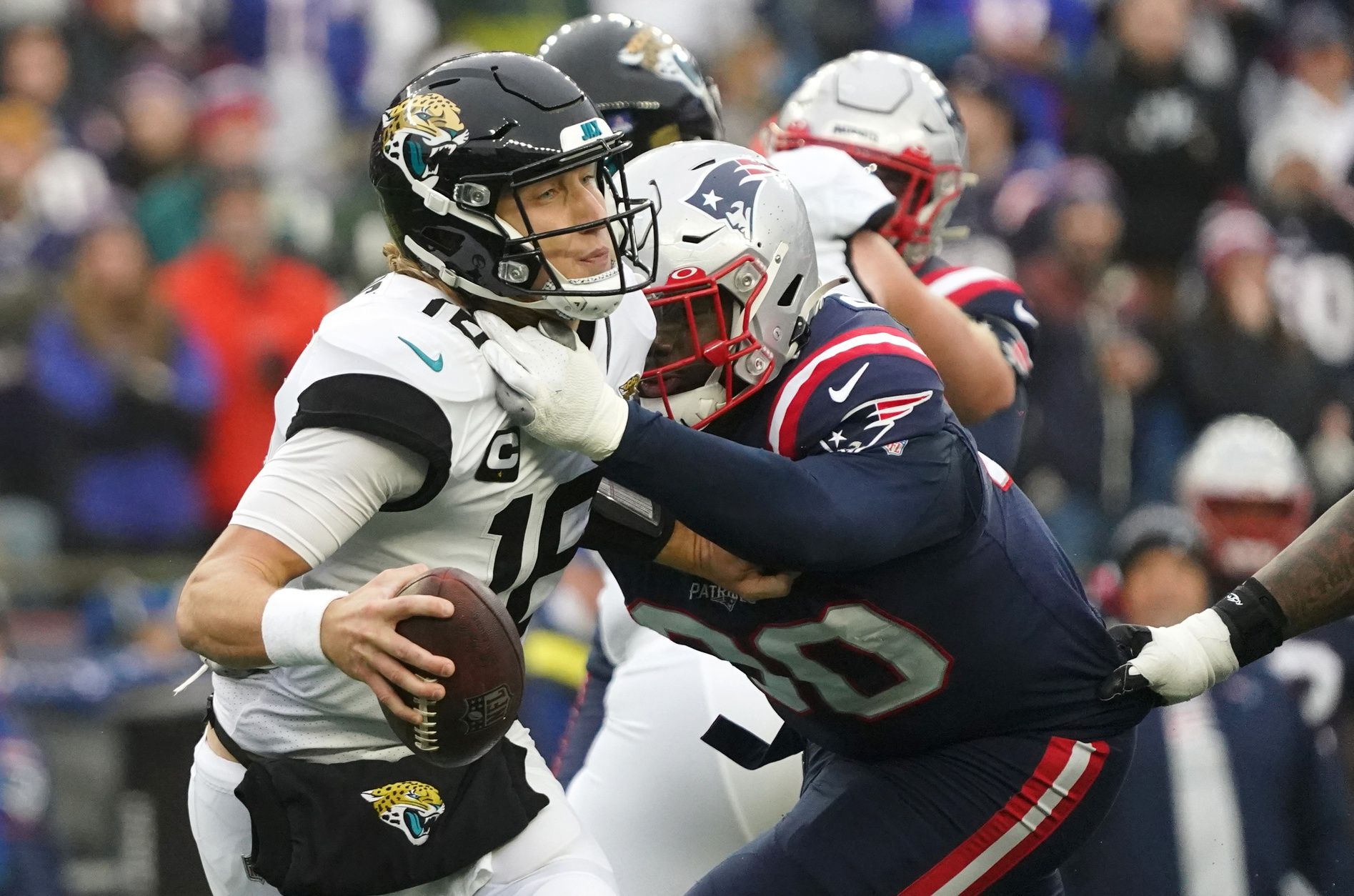 New England Patriots DL Christian Barmore (90) sacks Jacksonville Jaguars QB Trevor Lawrence (16).