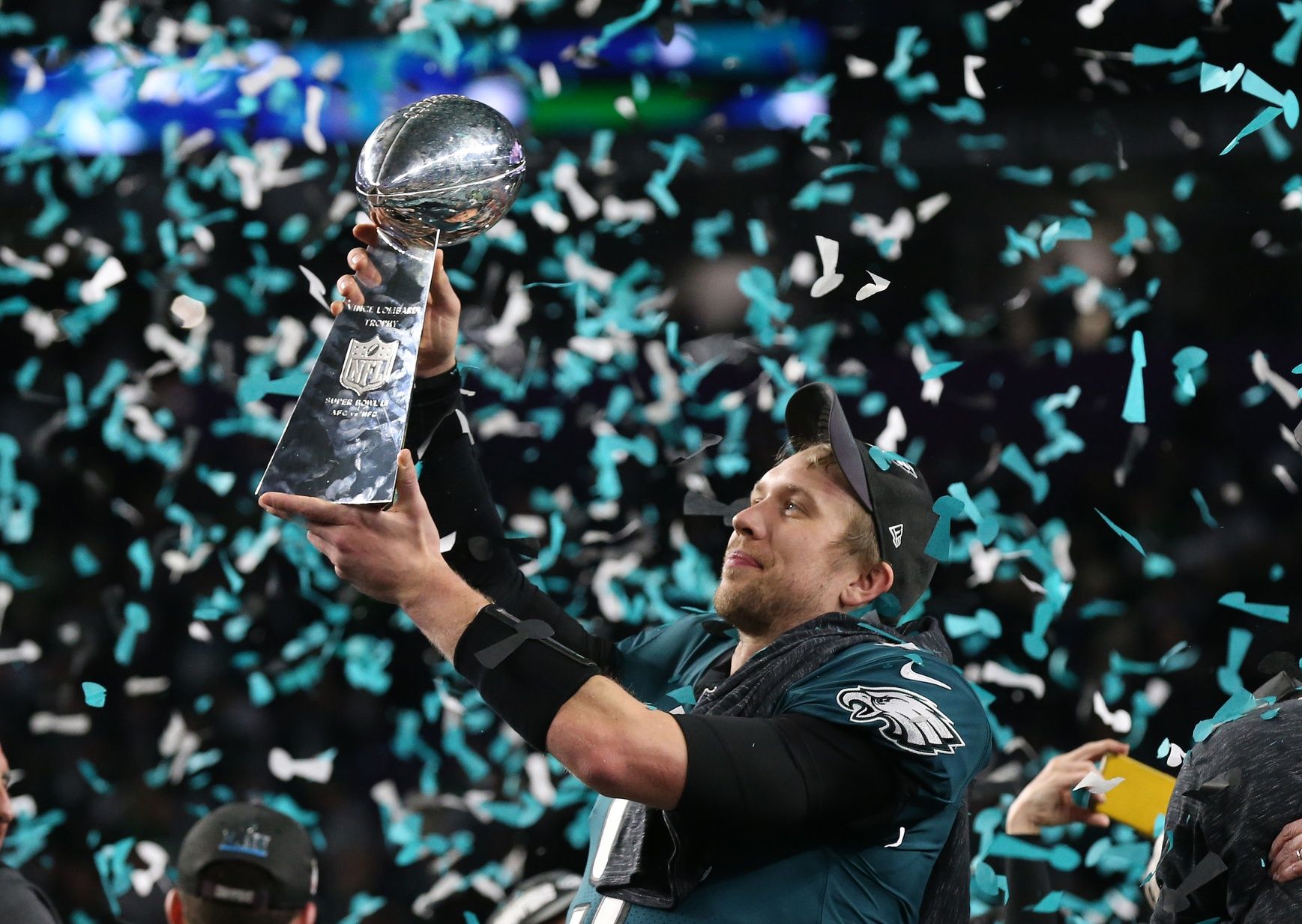 Philadelphia Eagles quarterback Nick Foles (9) hoist the Vince Lombardi Trophy after a victory against the New England Patriots in Super Bowl LII at U.S. Bank Stadium.