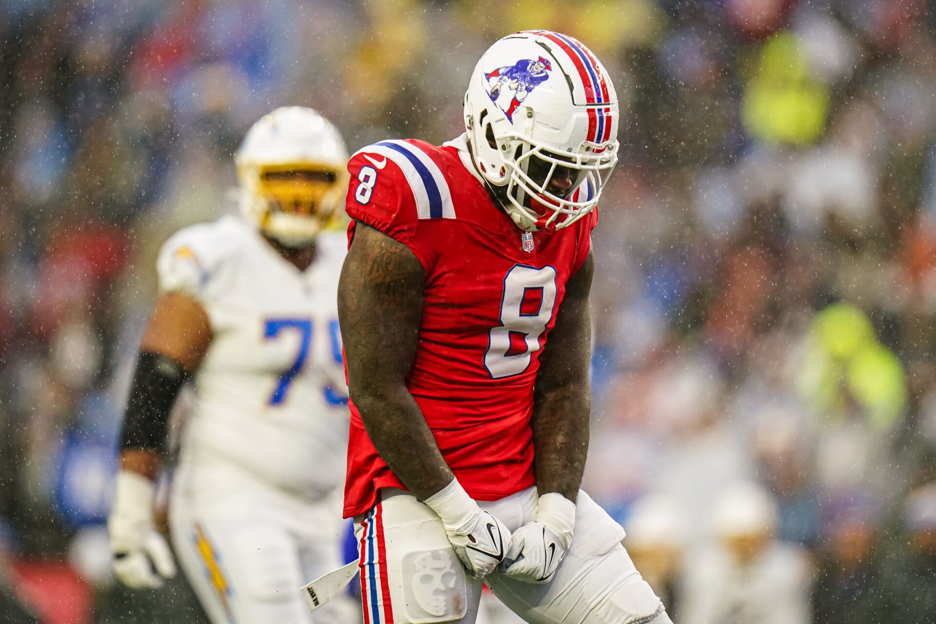 New England Patriots linebacker Ja'Whaun Bentley (8) reacts after his tackle against the Los Angeles Chargers in the second half at Gillette Stadium.