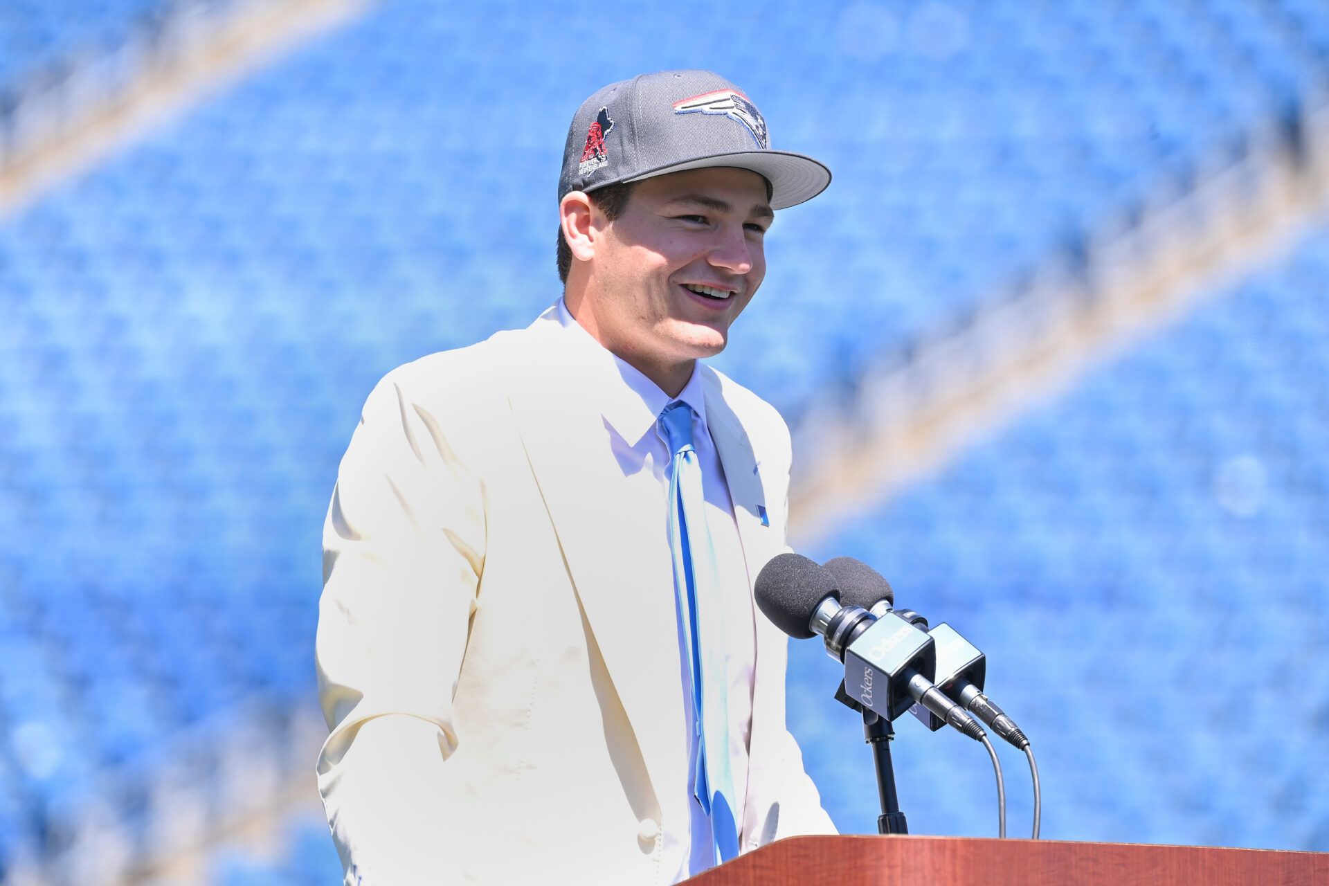 New England Patriots quarterback Drake Maye speaks to media on the game field after being drafted in the first round at Gillette Stadium.