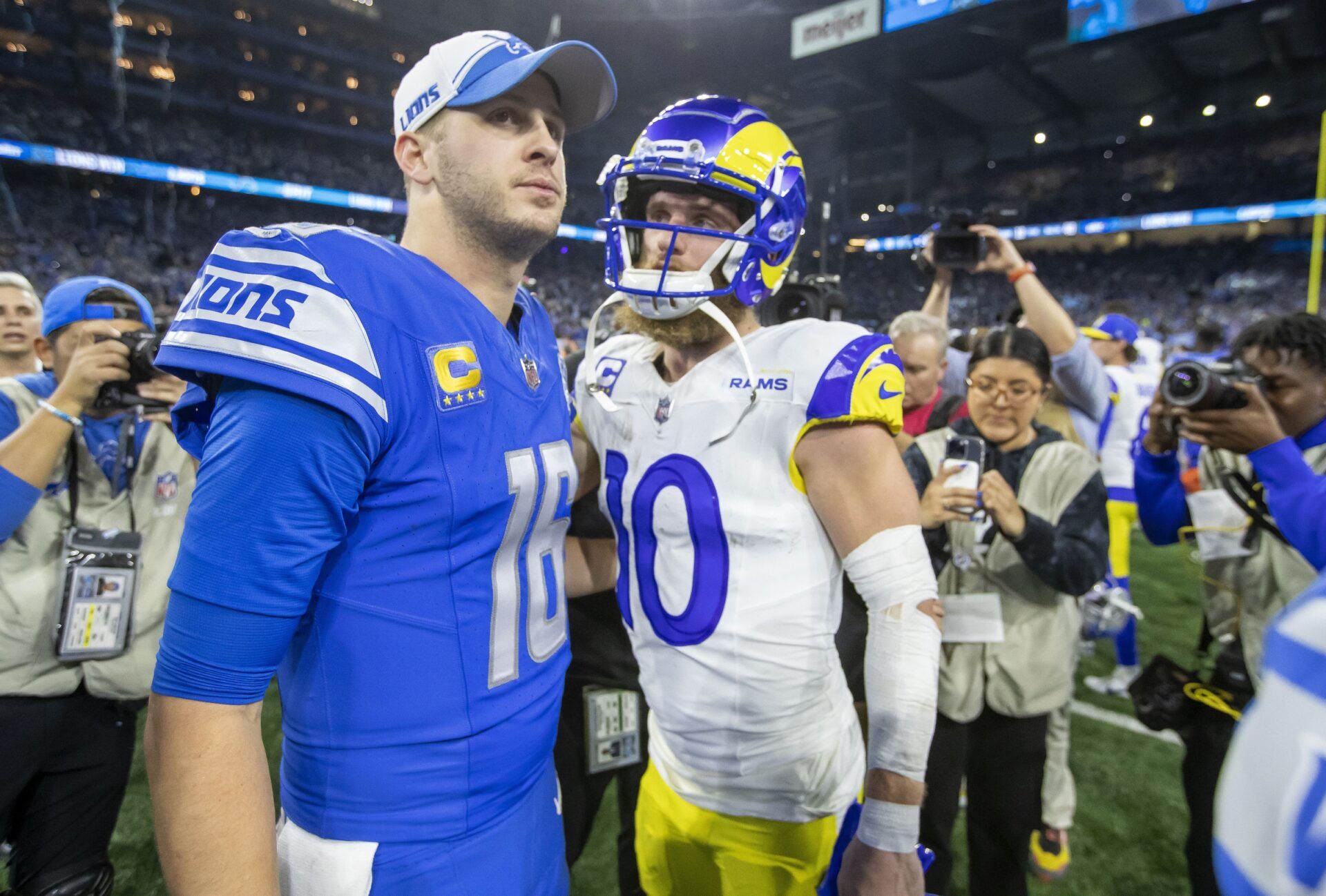 Detroit Lions quarterback Jared Goff (16) and Los Angeles Rams wide receiver Cooper Kupp (10) greet each other after a 2024 NFC wild card game at Ford Field. Mandatory Credit: David Reginek-USA TODAY Sports