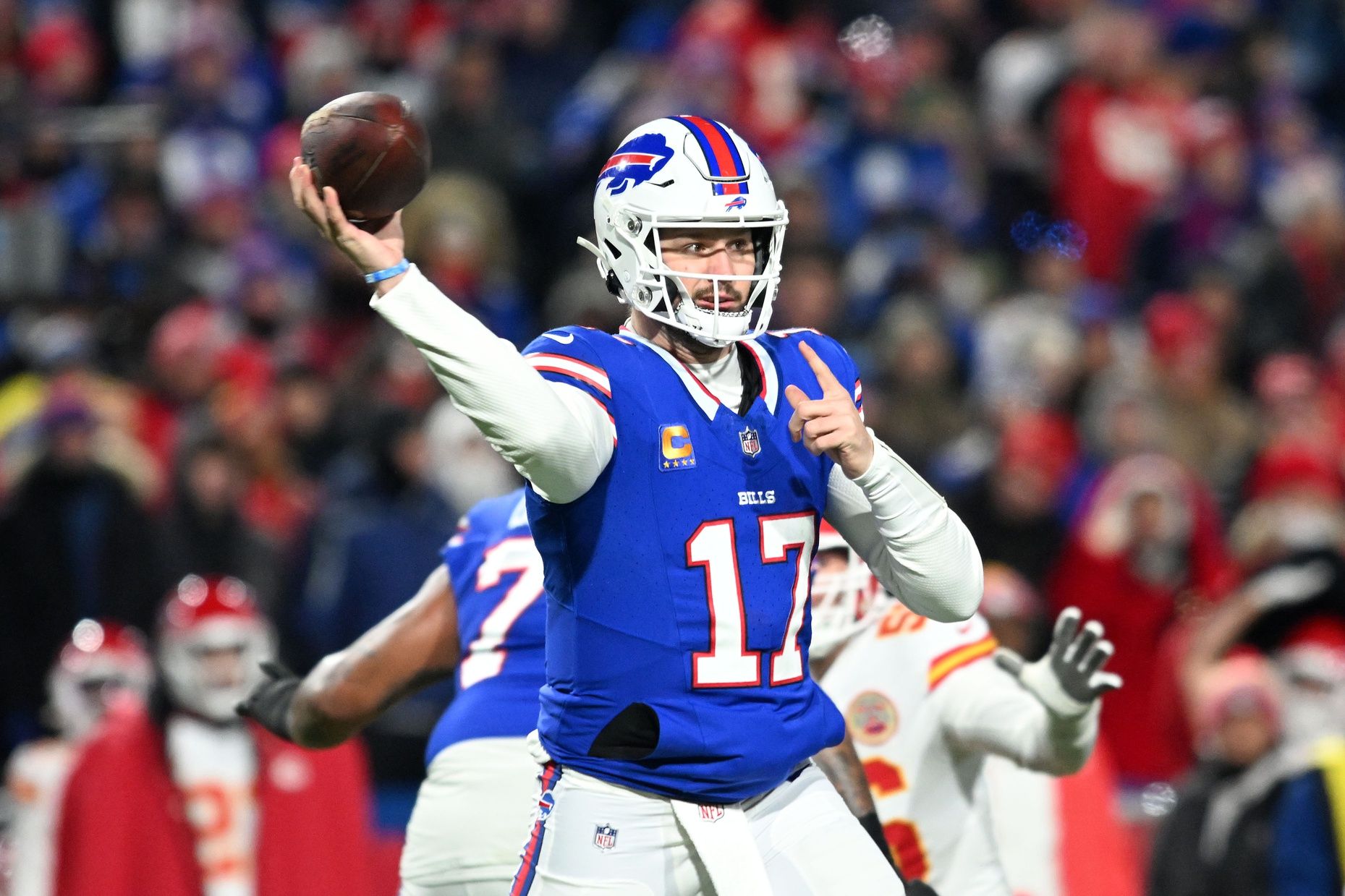 Buffalo Bills quarterback Josh Allen (17) drops back to pass against the Kansas City Chiefs in the first half of the 2024 AFC divisional round game at Highmark Stadium. Mandatory Credit: Mark Konezny-USA TODAY Sports