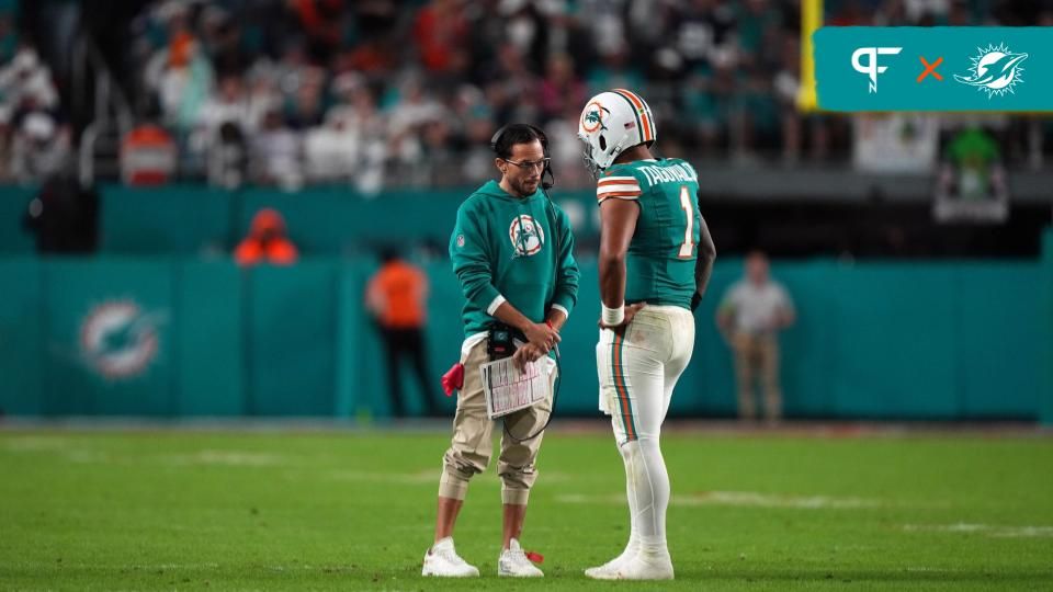 Miami Dolphins head coach Mike McDaniel talks with quarterback Tua Tagovailoa (1) during a timeout in the second half against the Dallas Cowboys at Hard Rock Stadium.