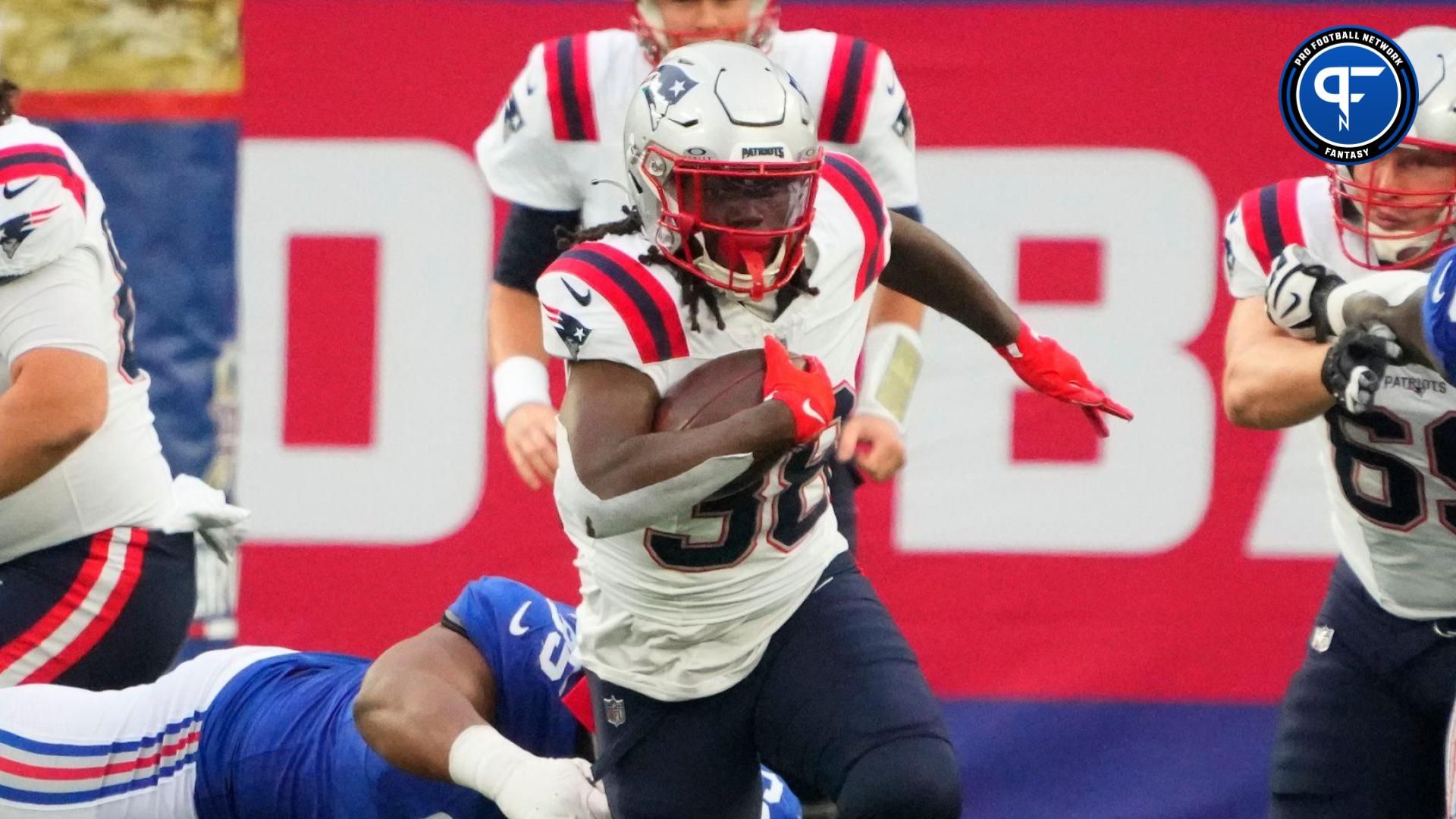 New England Patriots running back Rhamondre Stevenson (38) breaks out for a 1st down run against the New York Giants in the 1st half at MetLife Stadium.