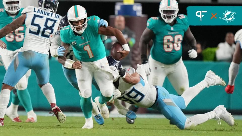 Miami Dolphins quarterback Tua Tagovailoa (1) gets taken down by Tennessee Titans safety Matthew Jackson (39) during the second half of an NFL game at Hard Rock Stadium in Miami Gardens, Dec. 11, 2023.