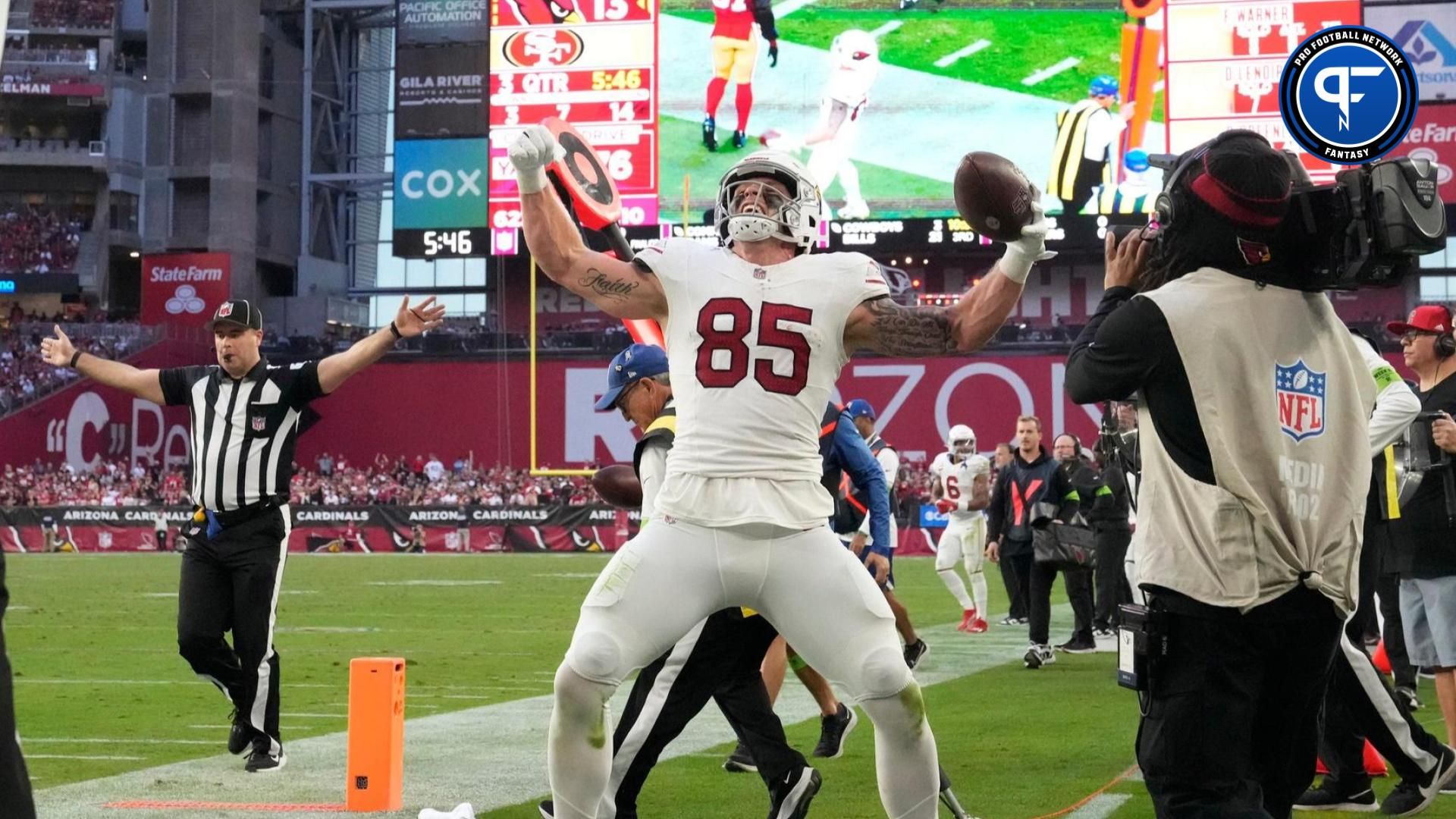 Arizona Cardinals tight end Trey McBride (85) celebrates after a first down against the San Francisco 49ers during the third quarter at State Farm Stadium.