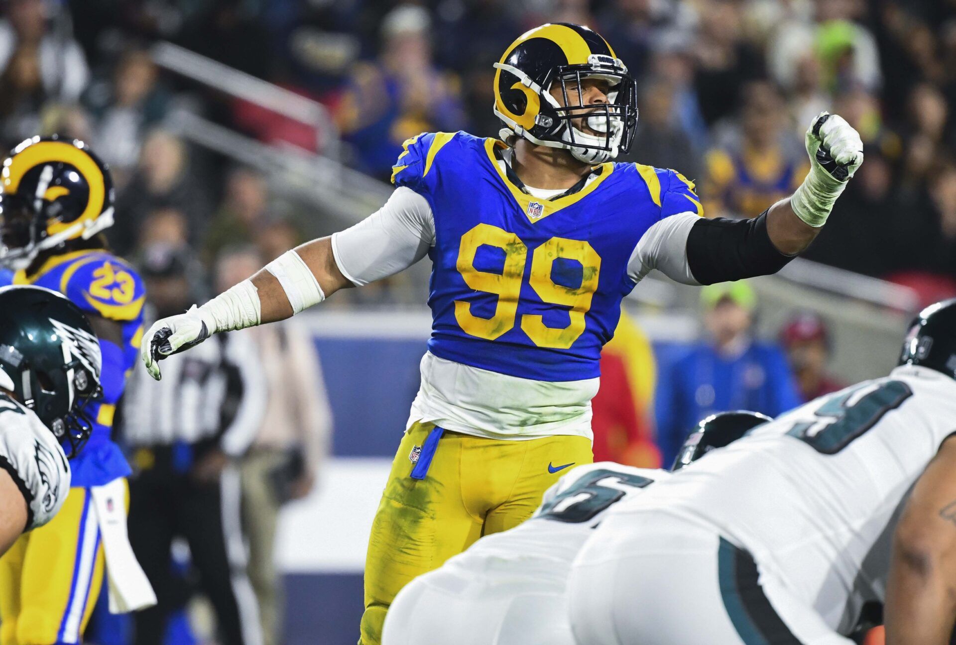 Los Angeles Rams defensive end Aaron Donald (99) signals to teammates during the first quarter against the Philadelphia Eagles at Los Angeles Memorial Coliseum.