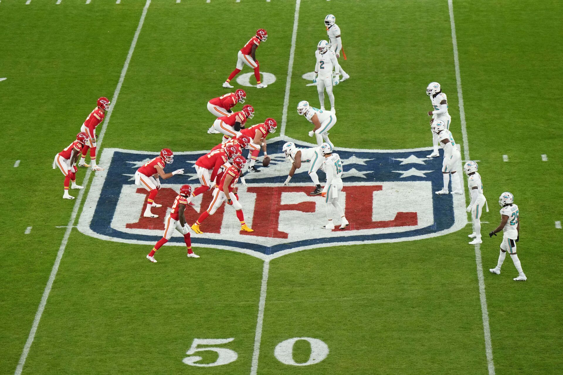 A general overall view as Kansas City Chiefs quarterback Patrick Mahomes (15) takes the snap against the Miami Dolphins on the NFL shield logo in the first half of an NFL International Series game at Deutsche Bank Park. There will be five more NFL International Games in 2024. Mandatory Credit: Kirby Lee-USA TODAY Sports