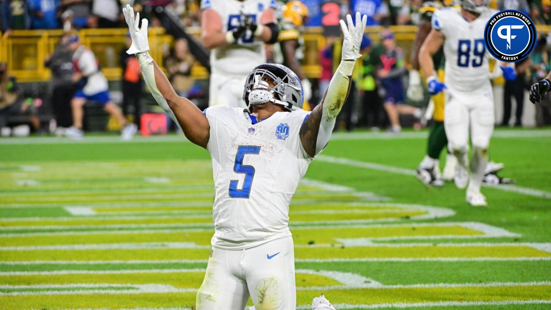 Detroit Lions running back David Montgomery (5) reacts after scoring a touchdown in the second quarter against the Green Bay Packers at Lambeau Field. Mandatory Credit: Benny Sieu-USA TODAY Sports