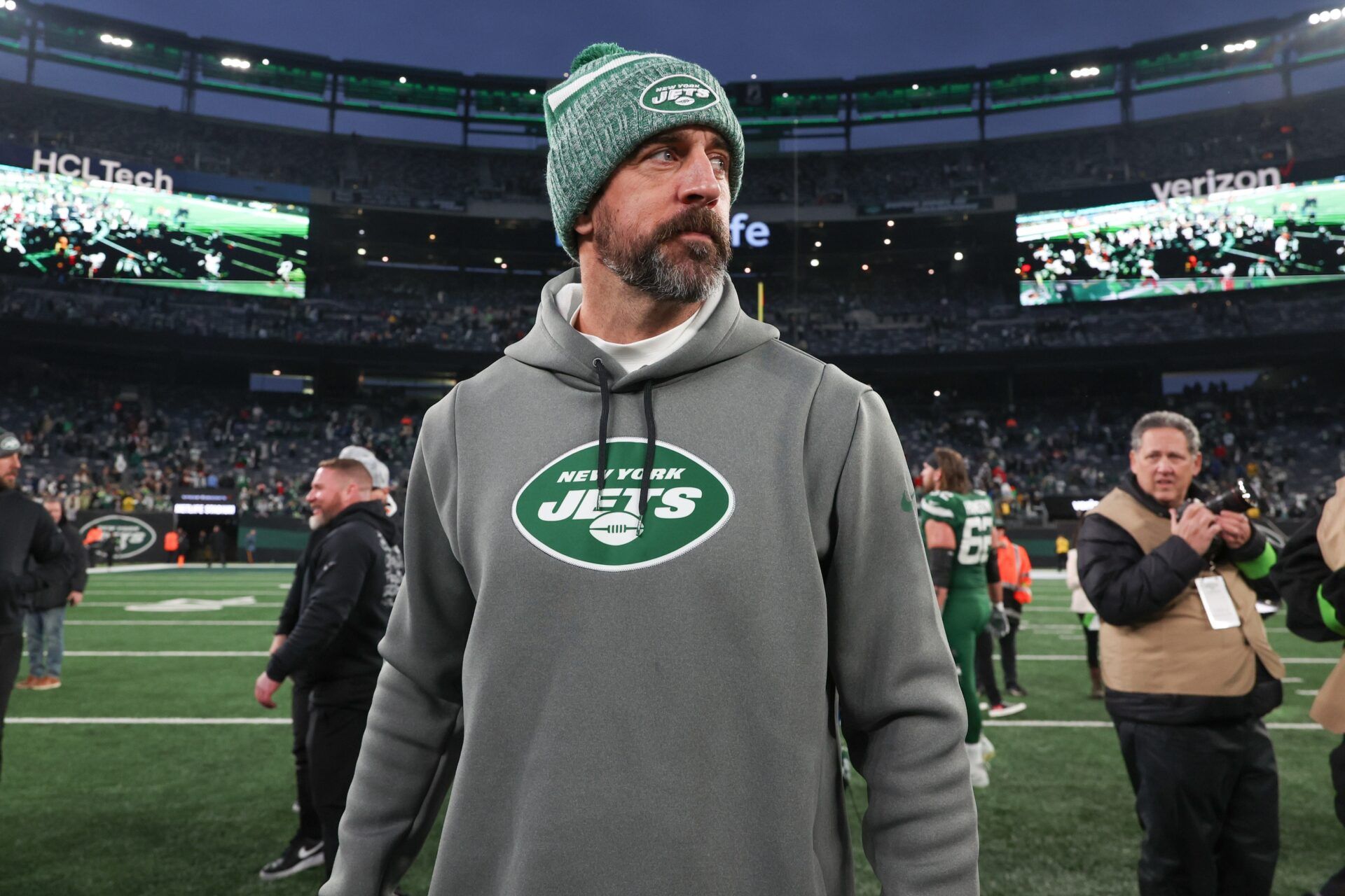 New York Jets quarterback Aaron Rodgers (8) on the field after the game against the Washington Commanders at MetLife Stadium. Mandatory Credit: Vincent Carchietta-USA TODAY Sports