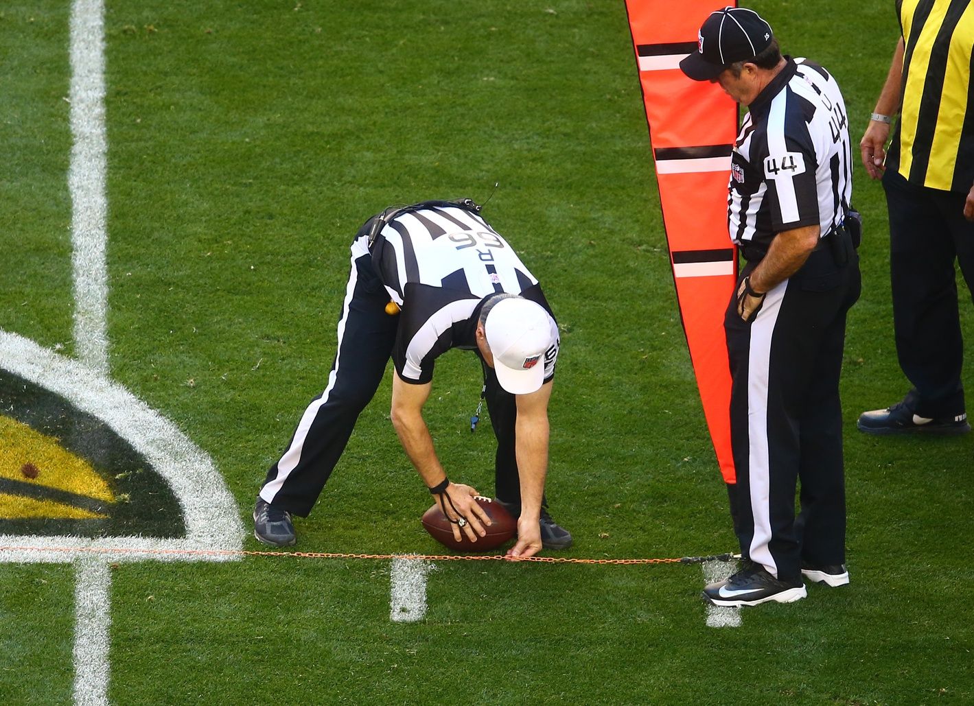 NFL referee Walt Anderson spots the ball after measuring with the chains during the game between the San Francisco 49ers and Arizona Cardinals players at University of Phoenix Stadium. NFL optical tracking will be a key thing to watch during this year's preseason.