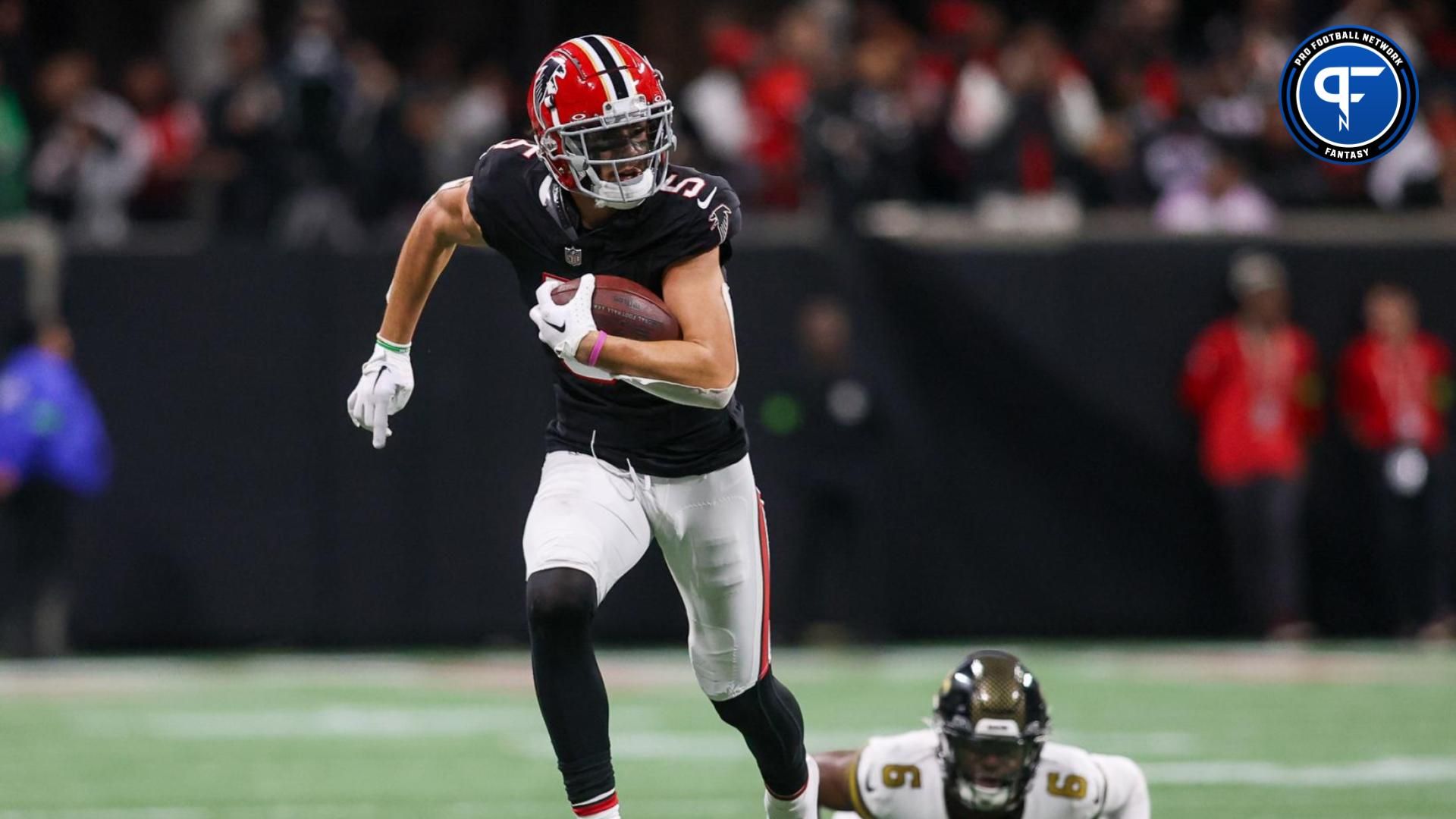 Atlanta Falcons wide receiver Drake London (5) runs after a catch against the New Orleans Saints in the second half at Mercedes-Benz Stadium.