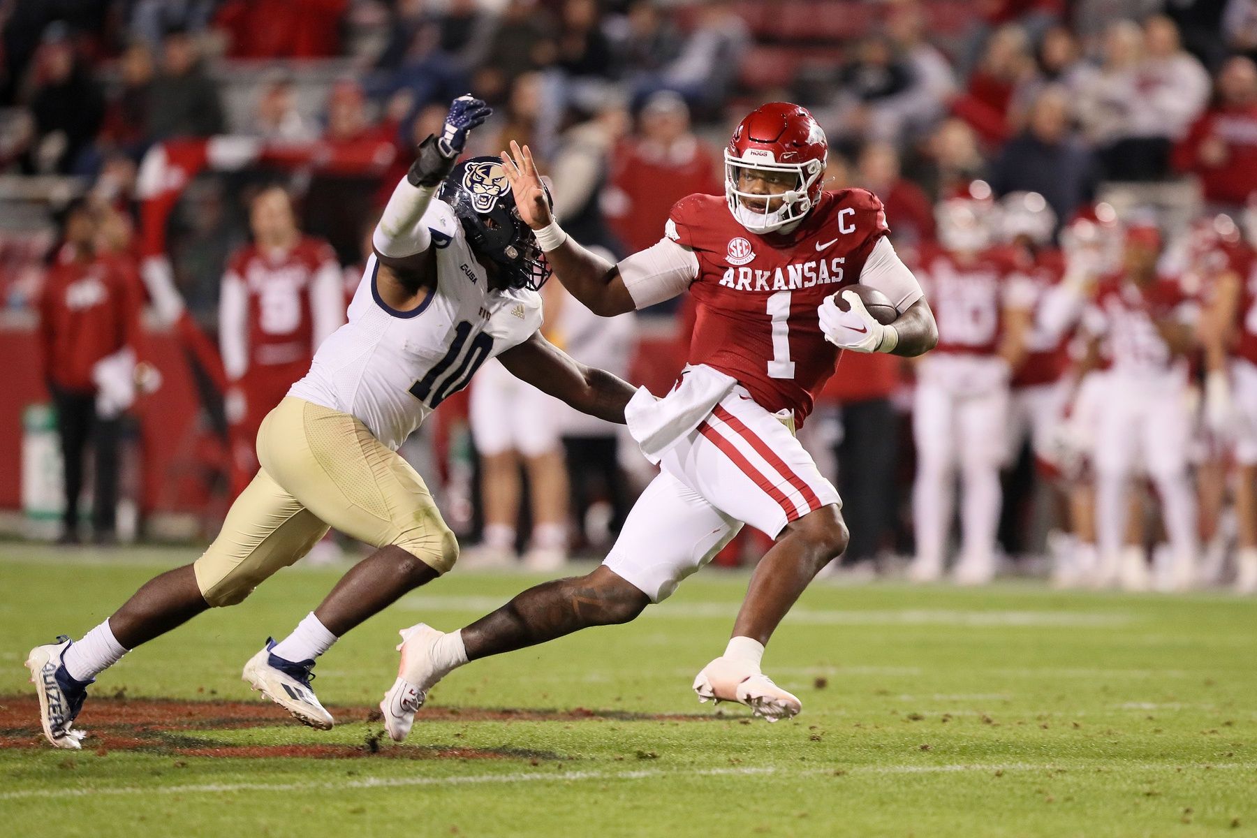 Arkansas Razorbacks QB KJ Jefferson runs with the ball against the FIU Panthers.