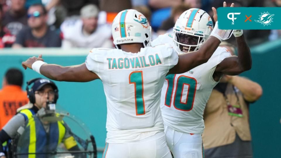 Miami Dolphins wide receiver Tyreek Hill (10) celebrates the touchdown of running back quarterback Tua Tagovailoa (1) during the second half at Hard Rock Stadium. Mandatory Credit: Jasen Vinlove-USA TODAY Sports