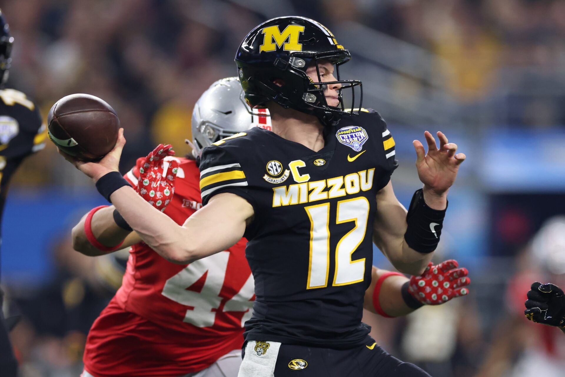 Missouri Tigers quarterback Brady Cook (12) throws a pass in the first quarter against the Ohio State Buckeyes at AT&T Stadium. Mandatory Credit: Tim Heitman-USA TODAY Sports