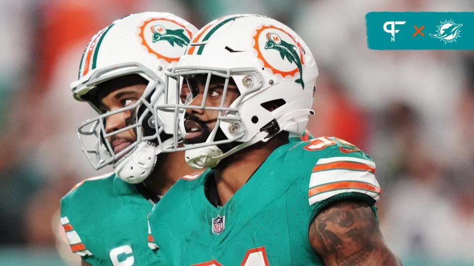 Miami Dolphins quarterback Tua Tagovailoa (1) congratulates running back Raheem Mostert (31) after scoring a touchdown against the Dallas Cowboys during the first half of an NFL game at Hard Rock Stadium in Miami Gardens, Dec. 24, 2023.