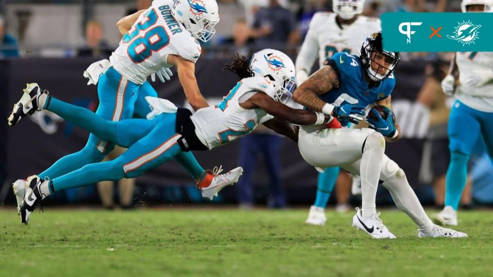 Miami Dolphins CB Cam Smith (24) tackles Jacksonville Jaguars WR Elijah Cooks (84).