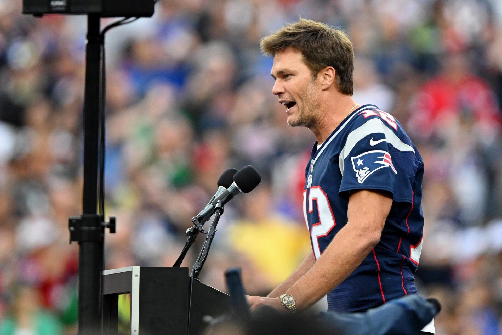 New England Patriots former quarterback Tom Brady speaks during a halftime ceremony in his honor during the game between the Philadelphia Eagles and New England Patriots at Gillette Stadium. Mandatory Credit: Brian Fluharty-USA TODAY Sports