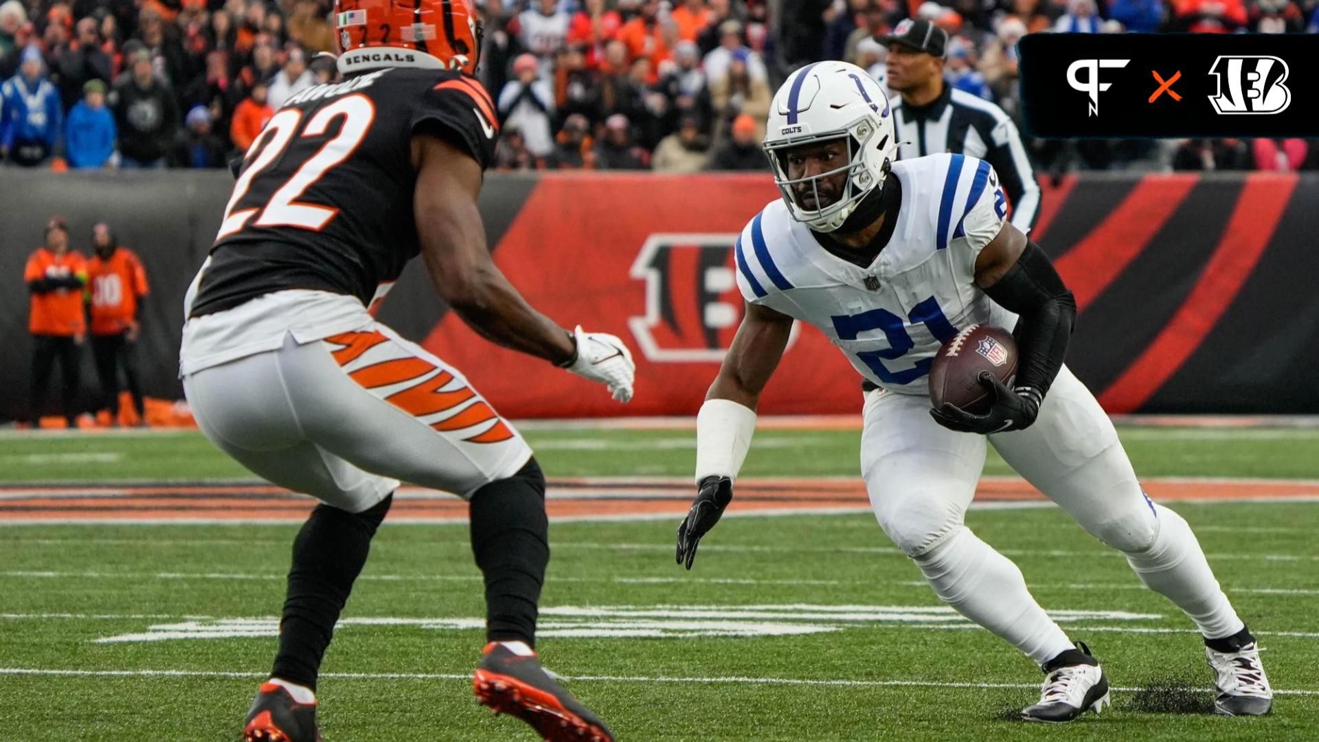 Colts running back Zack Moss (21) goes up against Bengals corner back Chidobe Awuzie (22) during the Bengals vs. Colts game at Paycor Stadium on Sunday December 10, 2023. The game was tied 14-14 at halftime.