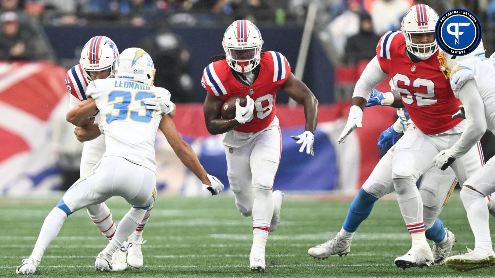 New England Patriots running back Rhamondre Stevenson (38) rushes against the Los Angeles Chargers during the first half at Gillette Stadium.