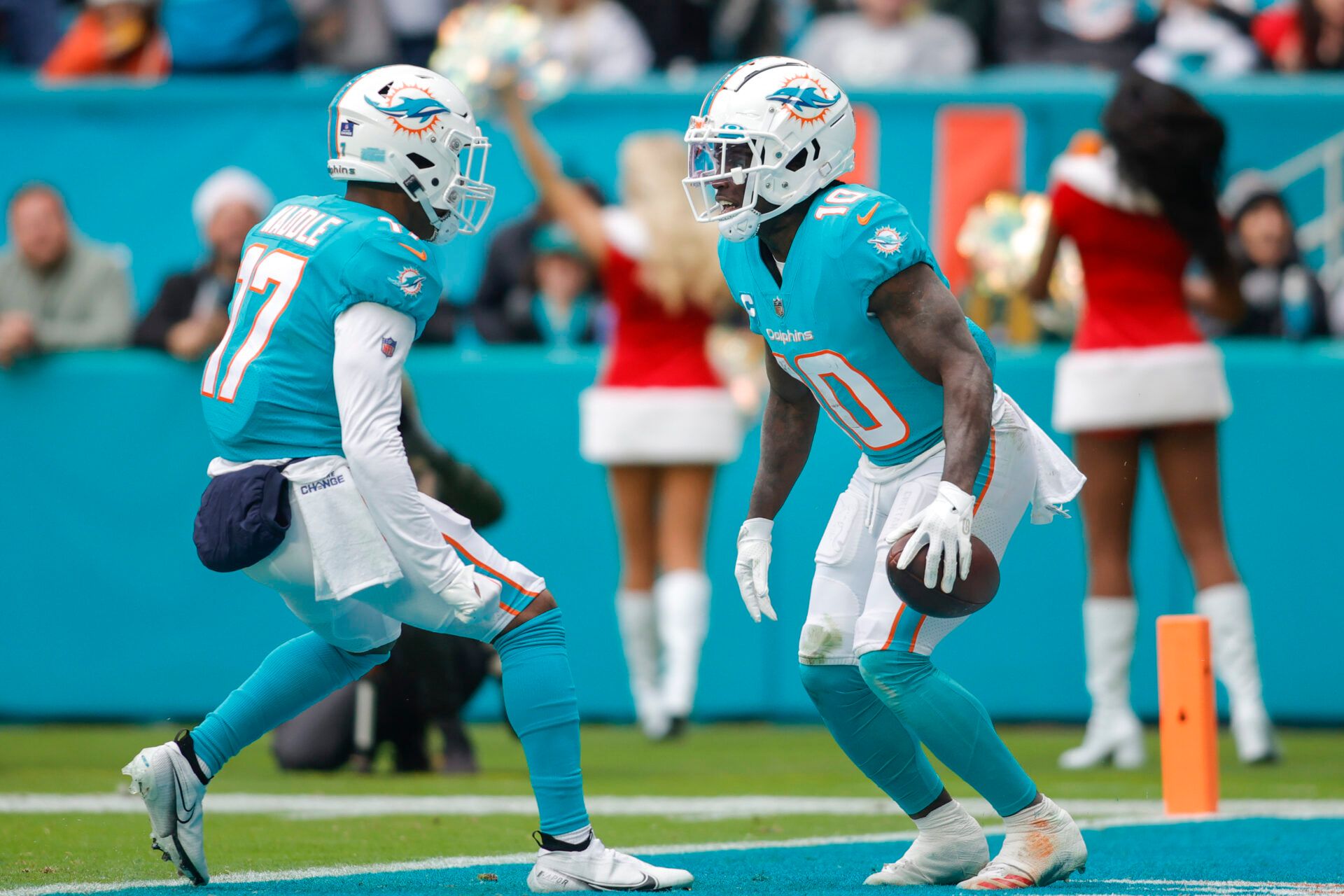 Miami Dolphins wide receiver Tyreek Hill (10) celebrates with wide receiver Jaylen Waddle (17) after catching the football during the second quarter against the Green Bay Packers at Hard Rock Stadium. Where do they rank among the best WRs in Dolphins history?