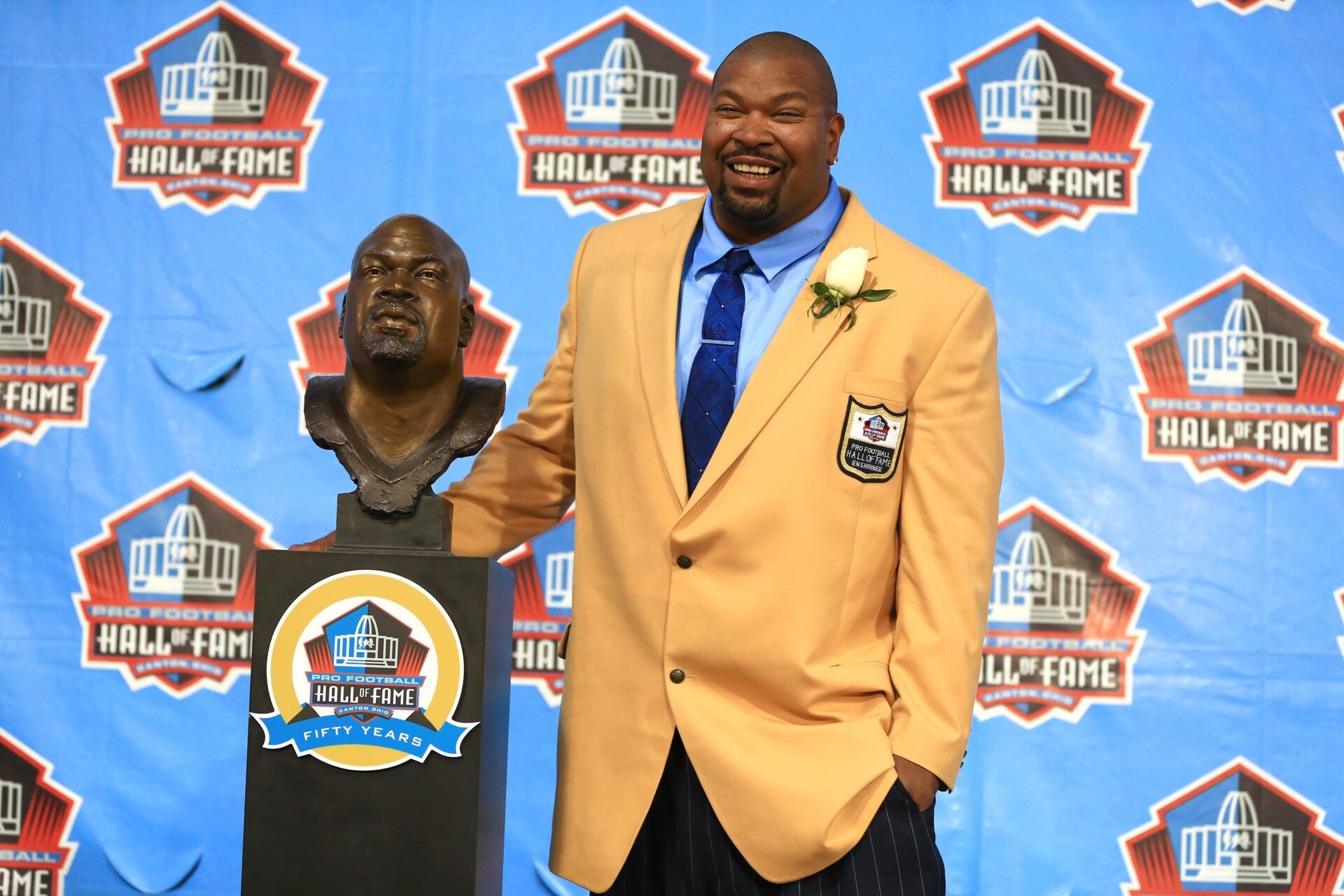 Dallas Cowboys former guard Larry Allen poses with the bust during the 2013 Pro Football Hall of Fame Enshrinement at Fawcett Stadium.