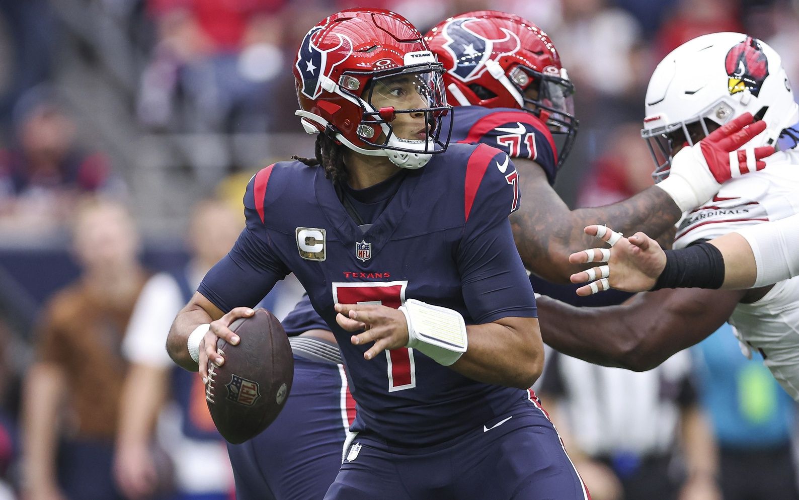 Houston Texans quarterback C.J. Stroud (7) looks for an open receiver during the game against the Arizona Cardinals at NRG Stadium. Mandatory Credit: Troy Taormina-USA TODAY Sports