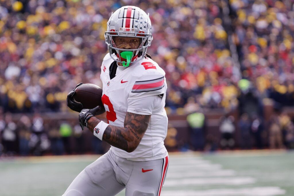 Ohio State Buckeyes wide receiver Emeka Egbuka (2) makes a reception for a touchdown in the first half against the Michigan Wolverines at Michigan Stadium. Mandatory Credit: Rick Osentoski-USA TODAY Sports