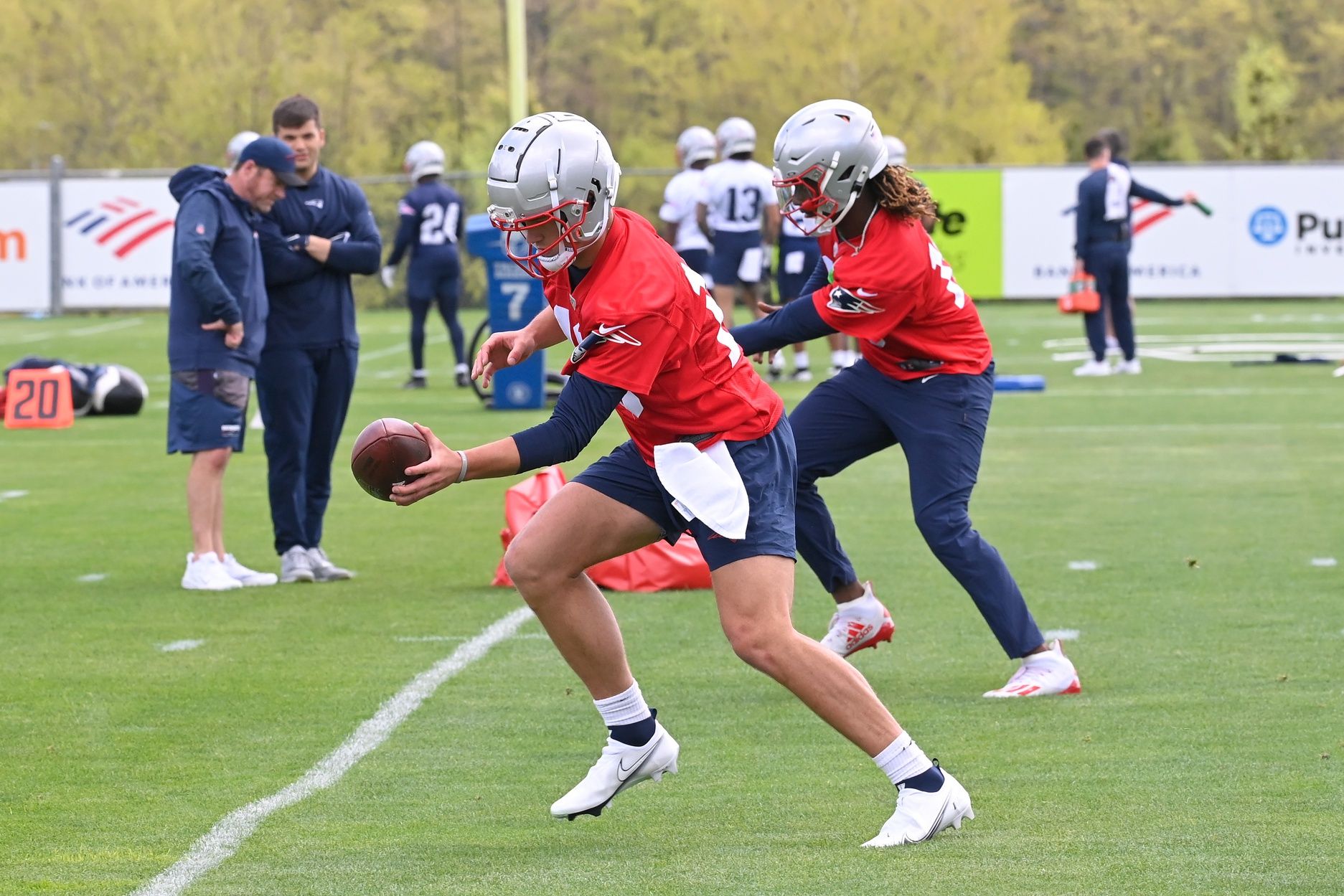 New England Patriots quarterback Drake Maye (10 (front) and quarterback Joe Milton III (19) (back) do a handoff drill at the New England Patriots rookie camp at Gillette Stadium. Mandatory Credit: Eric Canha-USA TODAY Sports