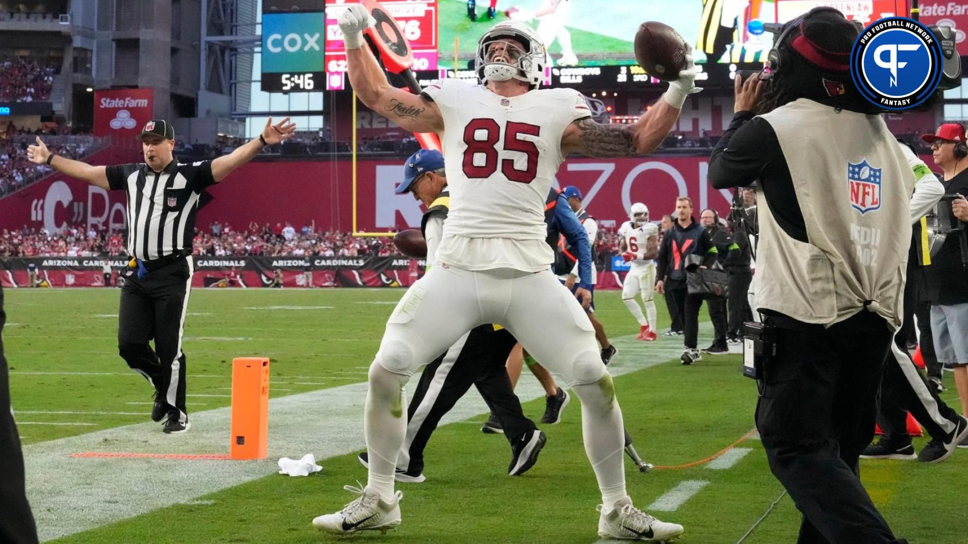 Arizona Cardinals tight end Trey McBride (85) celebrates after a first down against the San Francisco 49ers during the third quarter at State Farm Stadium.