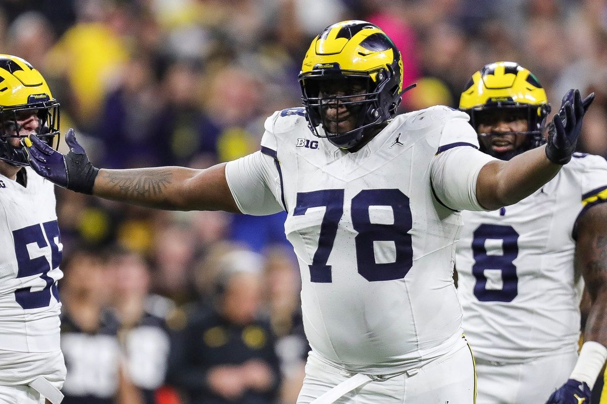 Michigan defensive lineman Kenneth Grant celebrates a tackle against Iowa running back Kaleb Johnson during the first half of the Big Ten championship game at Lucas Oil Stadium in Indianapolis, Ind. on Saturday, Dec. 2, 2023.