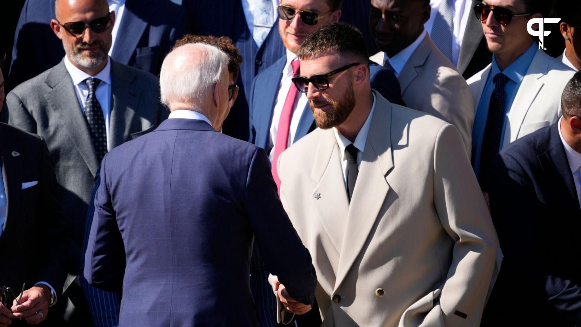 President Joe Biden shakes hands with Kansas City Chiefs TE Travis Kelce.