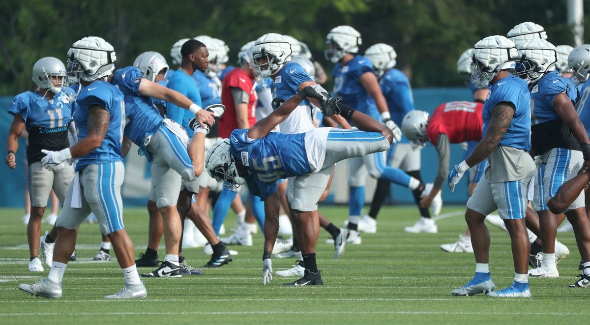 Detroit Lions players stretch before the start of training camp at team headquarers in Allen Park on Friday, July 28, 2023.