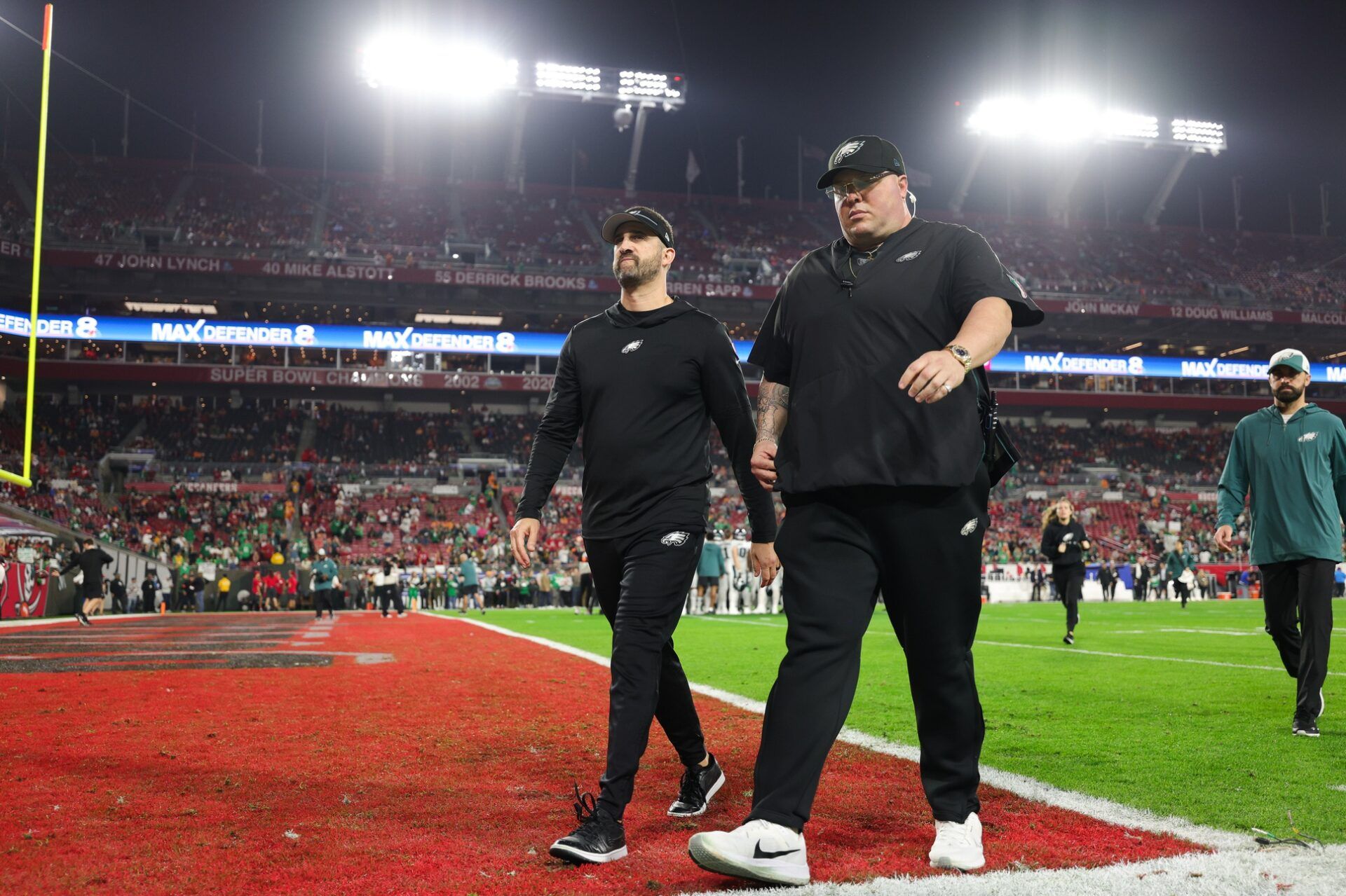 Philadelphia Eagles head coach Nick Sirianni and chief security officer Dom DiSandro walk off the field before a 2024 NFC wild card game against the Tampa Bay Buccaneers at Raymond James Stadium.