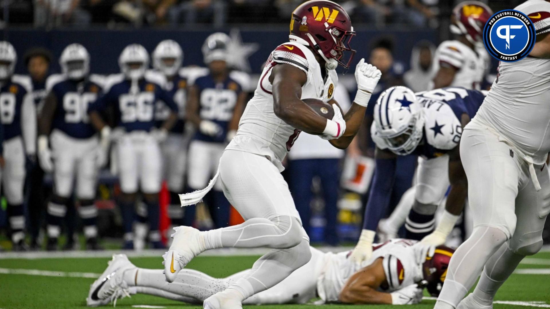 Washington Commanders running back Brian Robinson Jr. (8) in action during the game between the Dallas Cowboys and the Washington Commanders at AT&T Stadium.