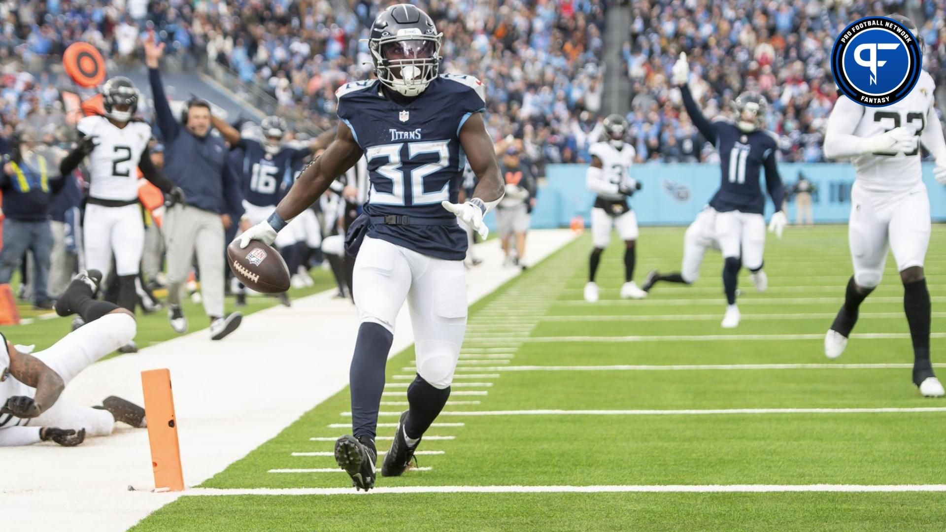 Tennessee Titans running back Tyjae Spears (32) runs for a touchdown against the Jacksonville Jaguars during the first half at Nissan Stadium.